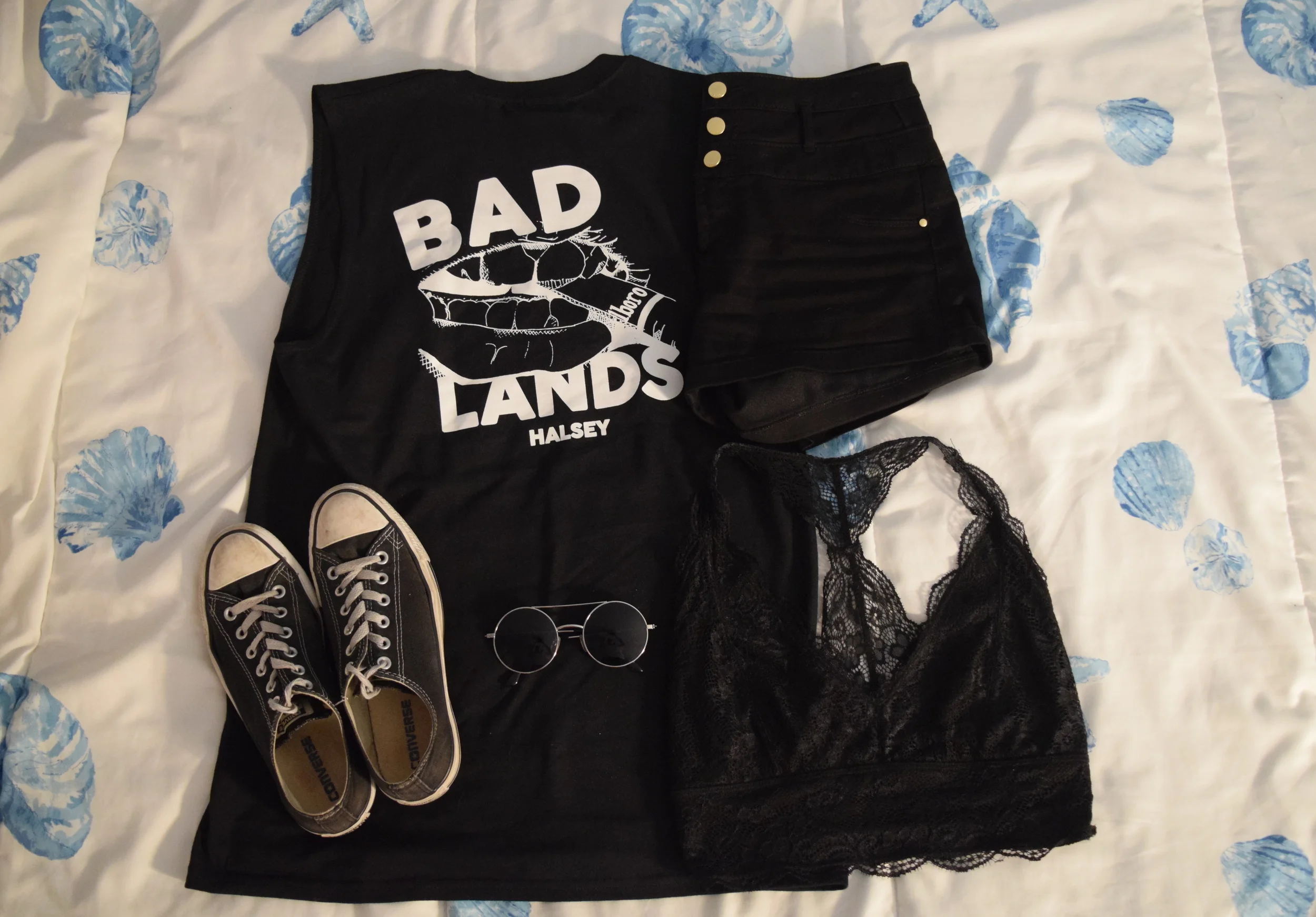 Tank (no longer being sold through Halsey’s store ). Shorts . Sneakers . Sunglasses (similar). Bralette .