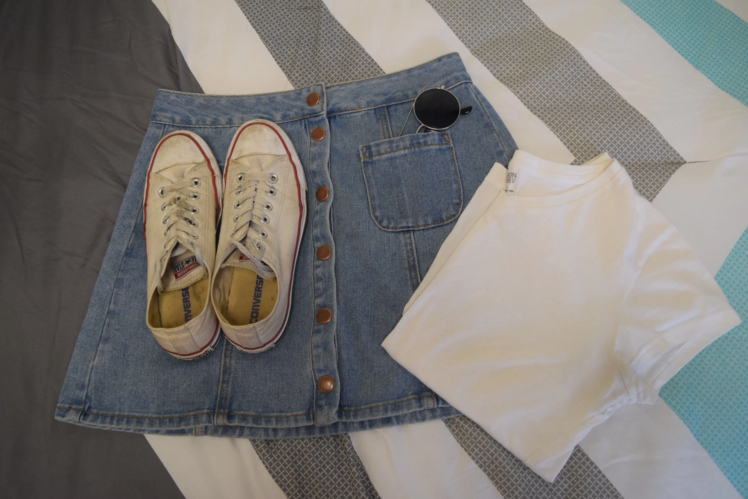 Shirt . Skirt (different color). Sneakers . Sunglasses (similar).