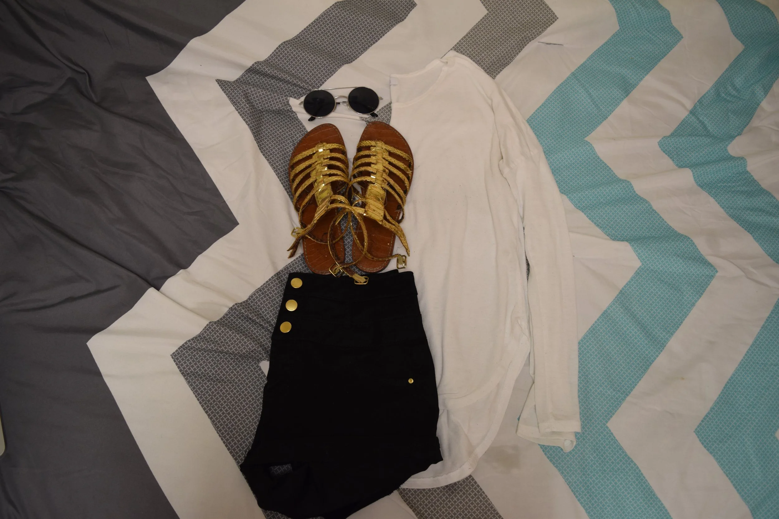 Shirt (no longer being sold at dELiA*s ). Shorts . Sandals (no longer being sold at Sam Edelman ). Sunglasses (similar).