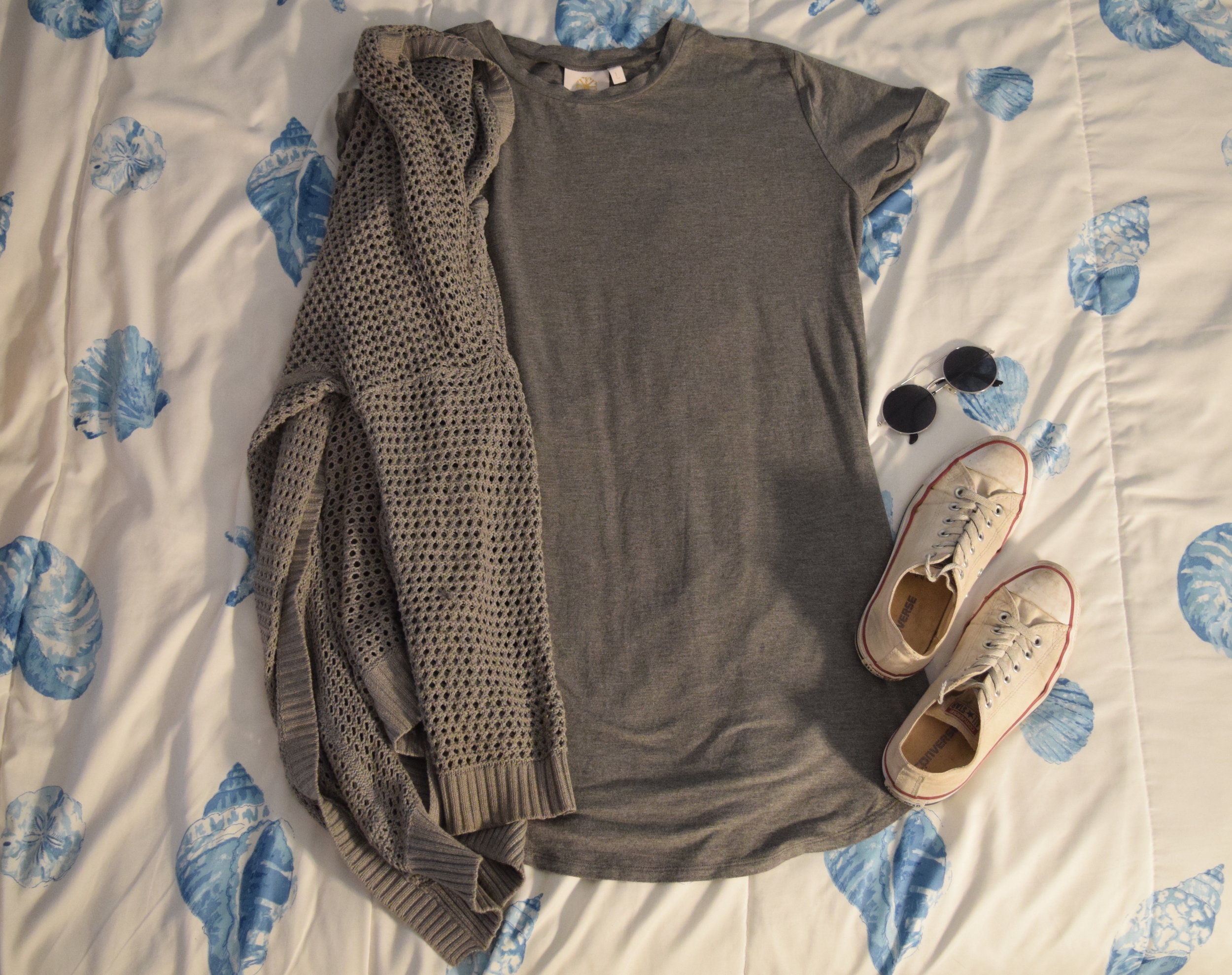 Dress . Sweater (no longer being sold at The Gap ). Sneakers . Sunglasses (similar).