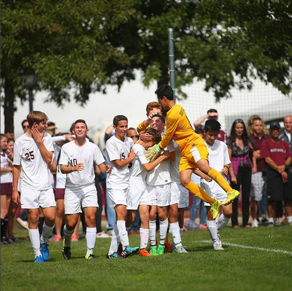 The Boys Varsity Soccer Team Exhilarated After Championship Game.