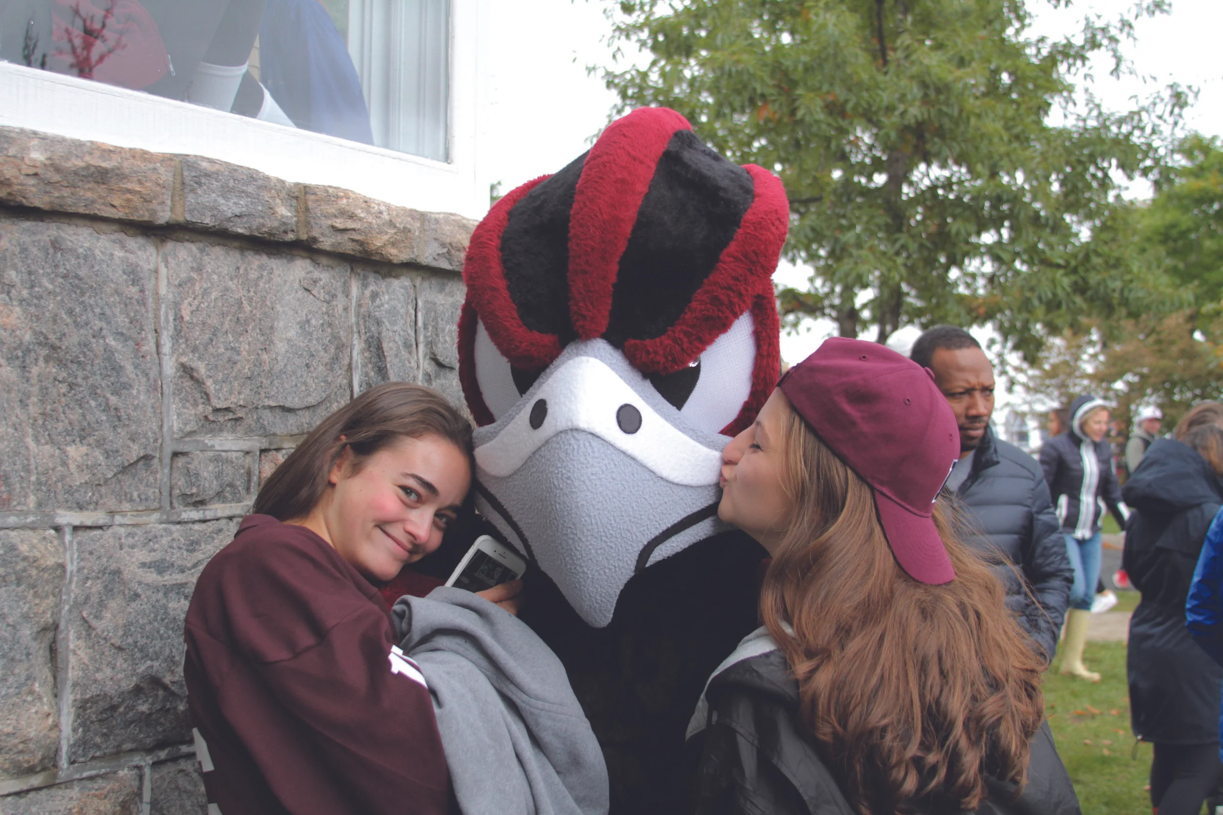 Photo Courtesy of Maria Hatzioanidis Felix the Falcon with Some Fans at the Soccer Game.