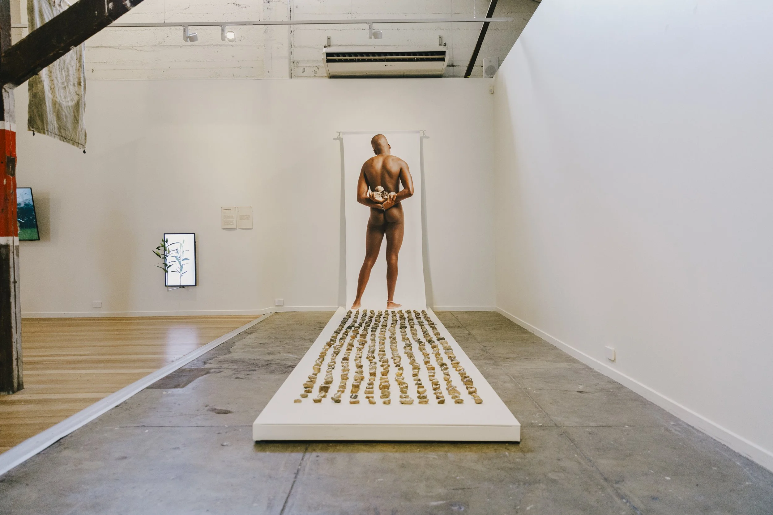   Ar, print on fabric, Arabic Calligraphy on 600 stones, Incinerator Gallery, 2024   “Your belief is a belief; my existence is a reality” – Divina Di Campo, Drag queen.  Homosexuality is still a crime in at least 74 countries, 13 of which impose deat