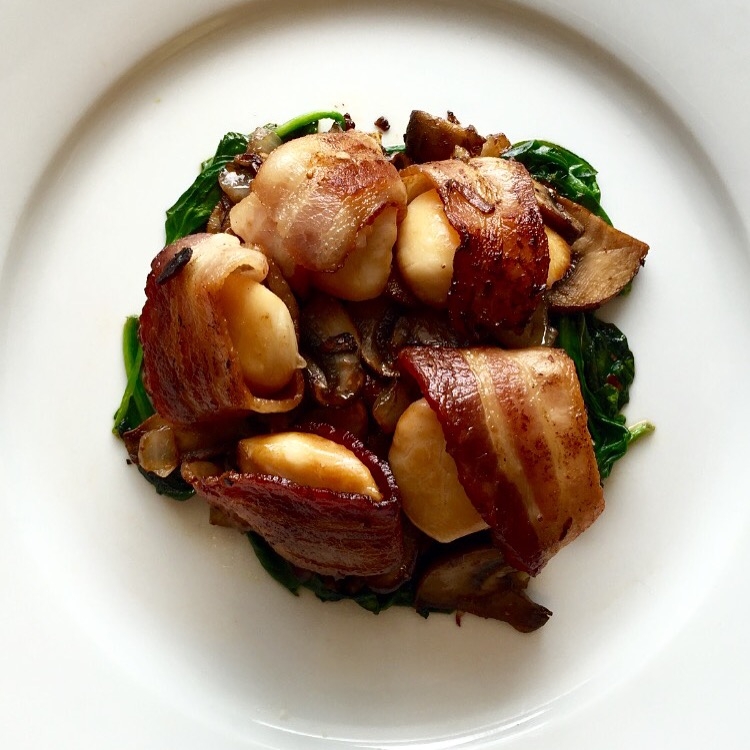 Photo Credit: Anna Bryant Bacon Wrapped Scallops on a bed of sautéed spinach and mushrooms made by me with ingredients from Pike Place Market in Seattle