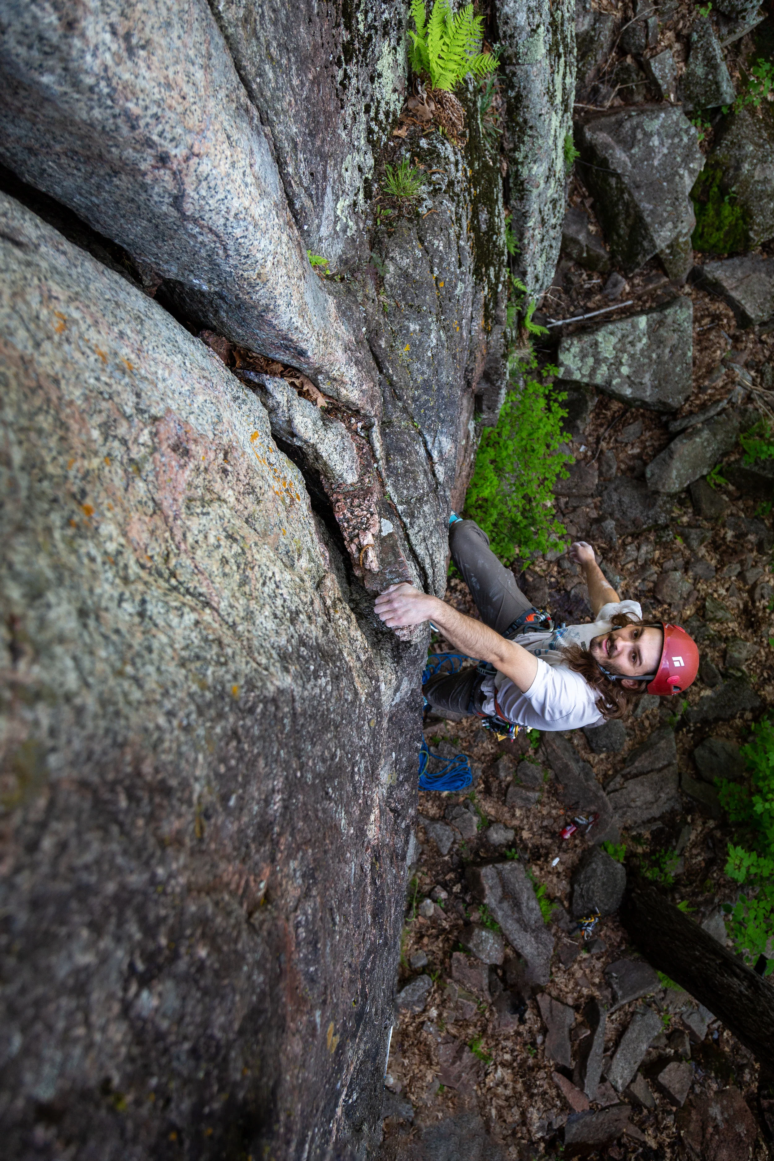 Rock climber ascending mountain