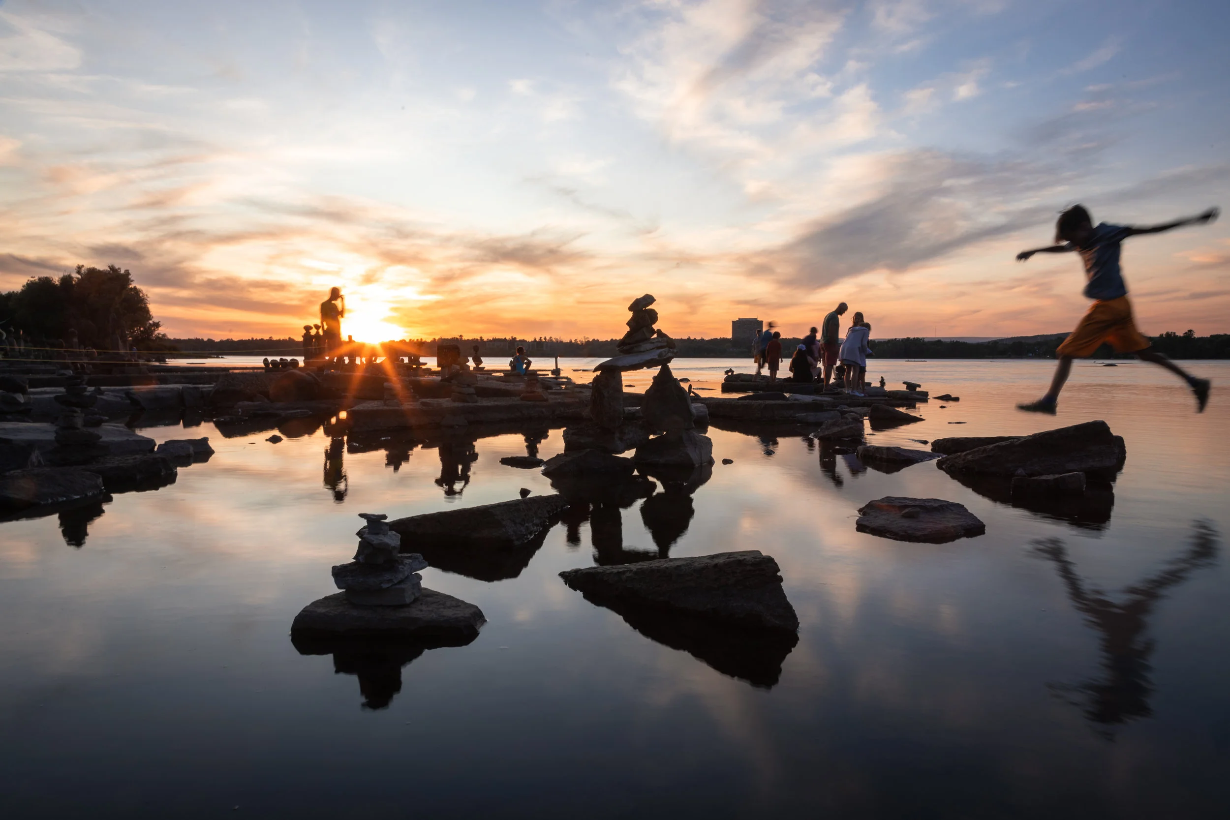 Kids playing in the sunset
