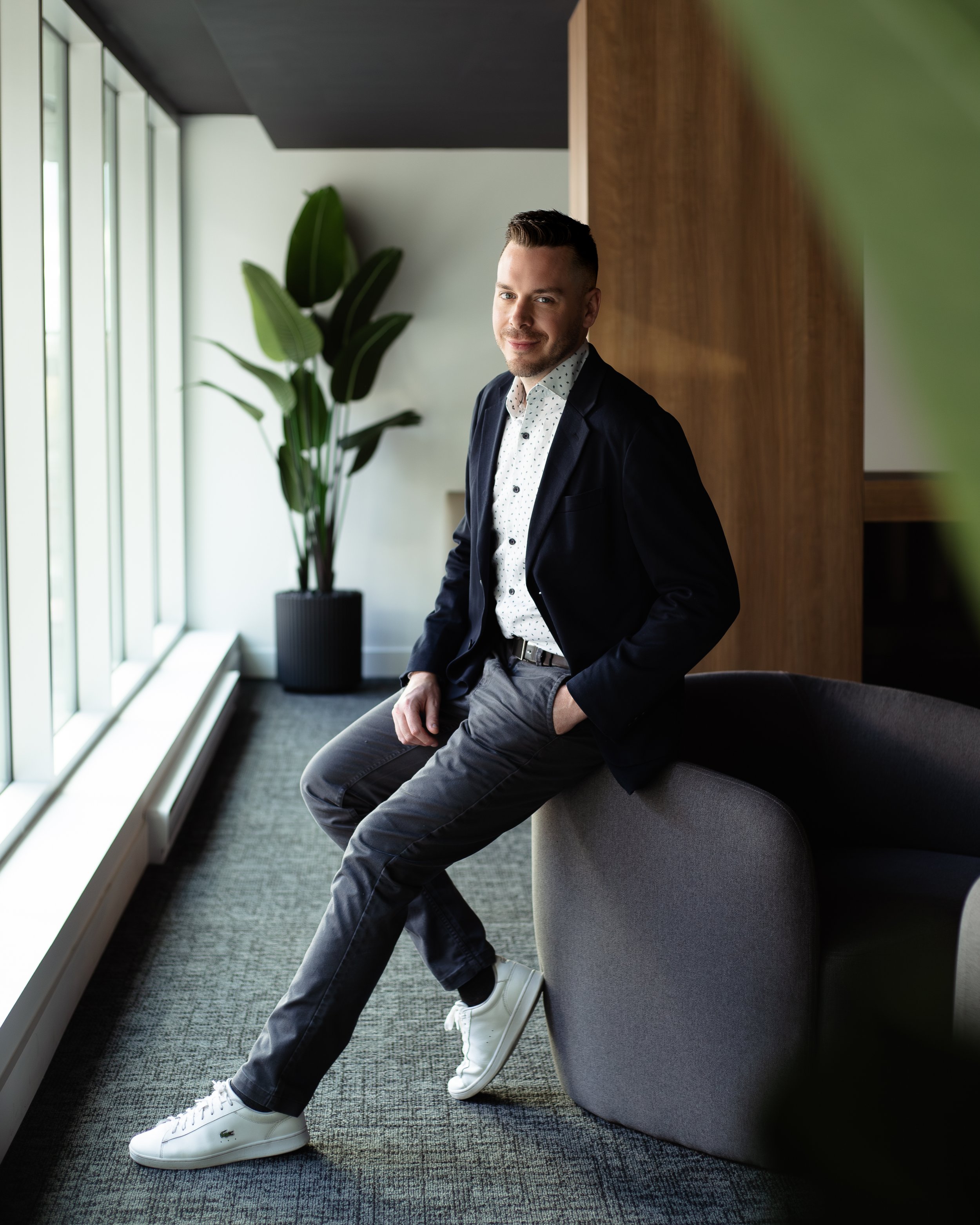 Professional headshot of Eric Pilotte in a studio setting