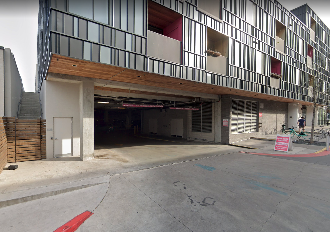 Building 2 / retail parking garage entrance with PINK height markers.