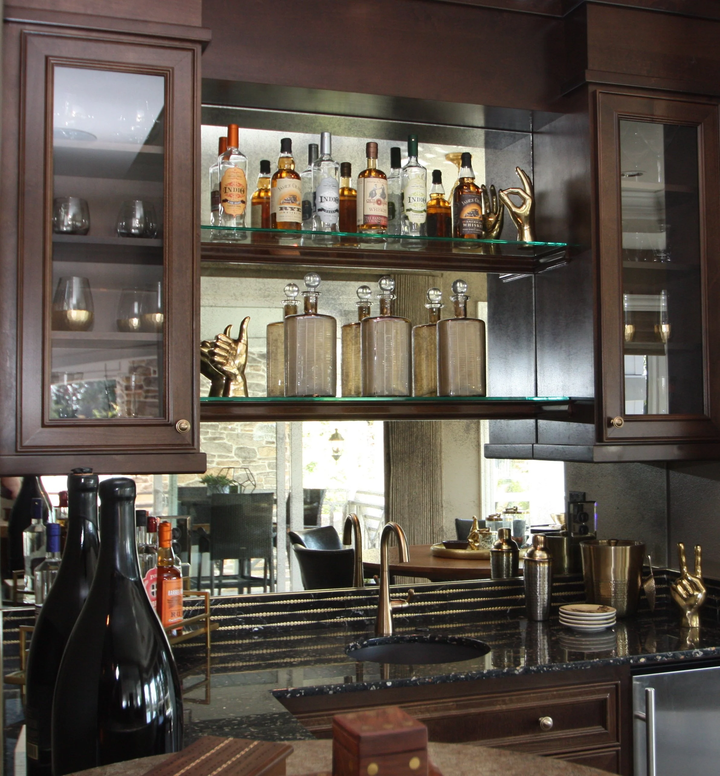 Antique mirror is a stunning accent for a home bar.