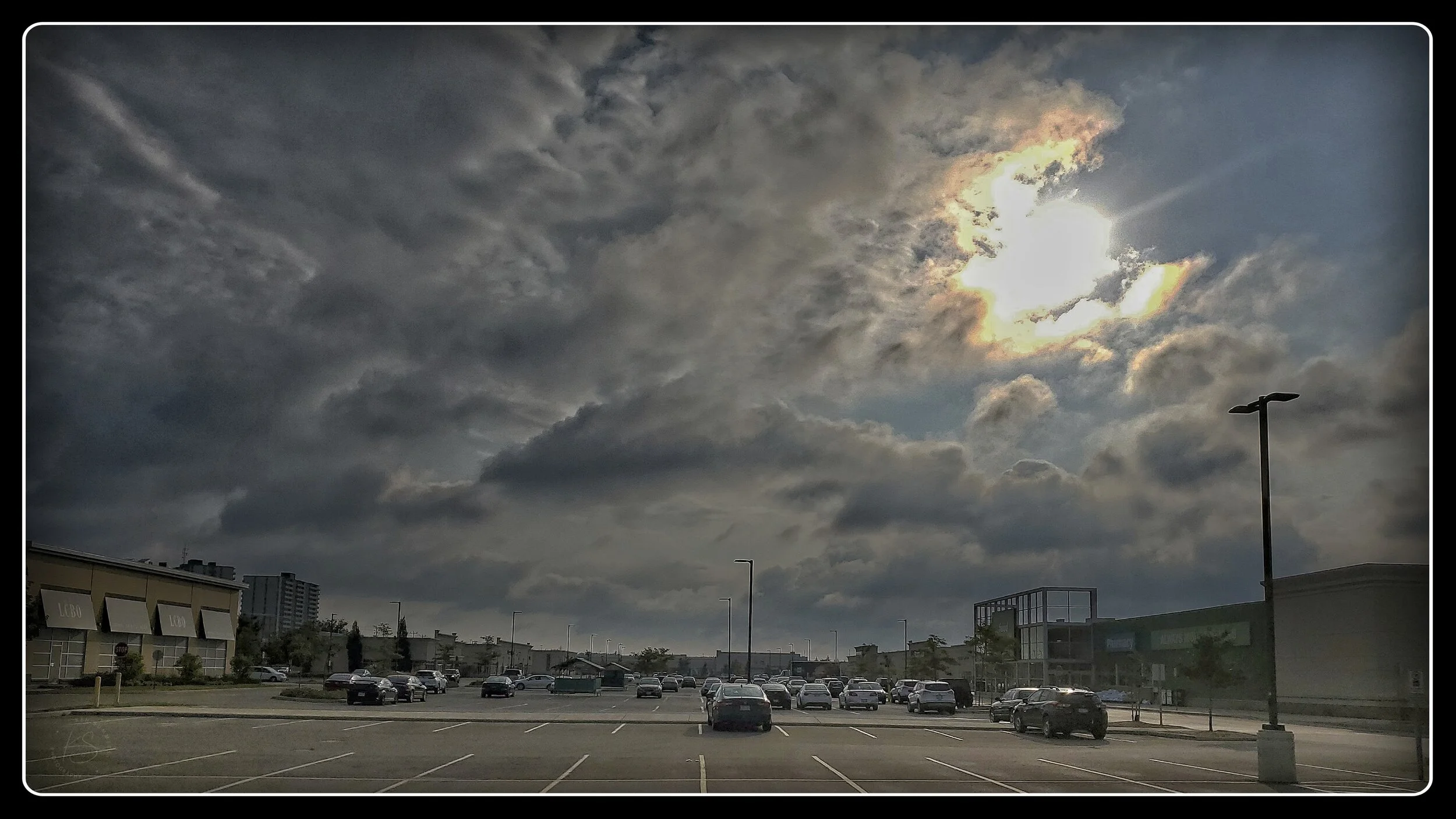 Sun coming through Storm Clouds over KWIMG_0142-1.jpg