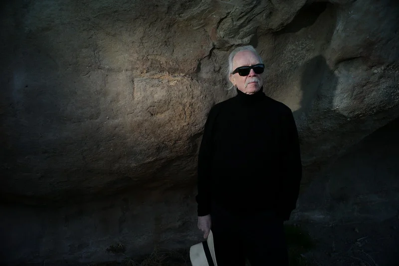 KyleCassidy_turtleneck_holdinghat.jpg