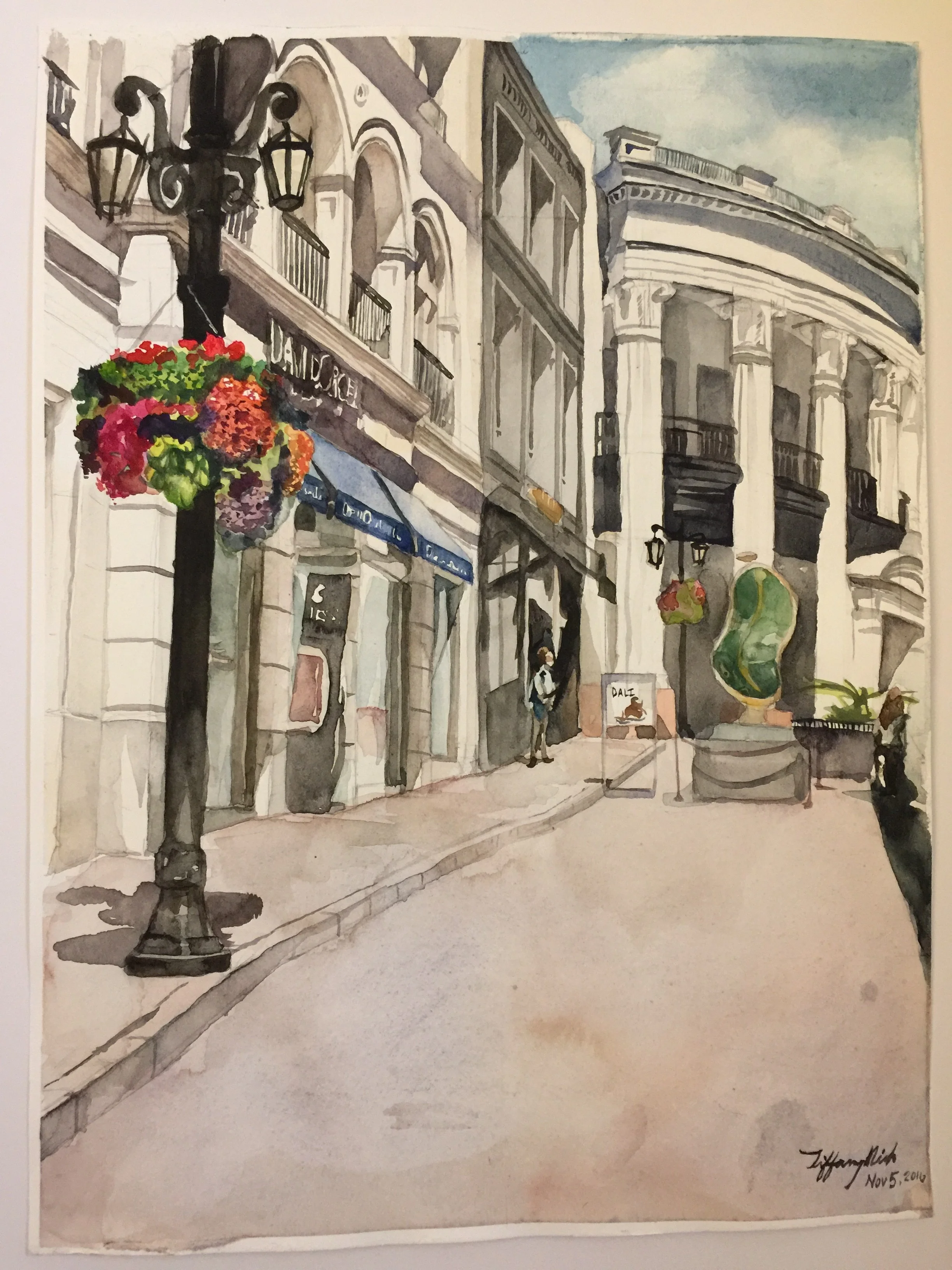 Watercolor painting of Rodeo drive in Beverly Hills, CA. In the back is the Porsche Design studio, and closer on the left is the David Orgell jewelry exhibit. 