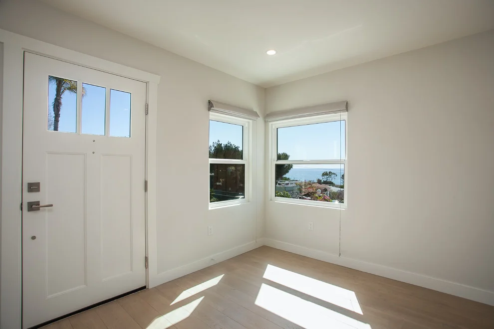 San-Joaquin- Laguna-Beach-beach-style-living-room-window-view.jpg