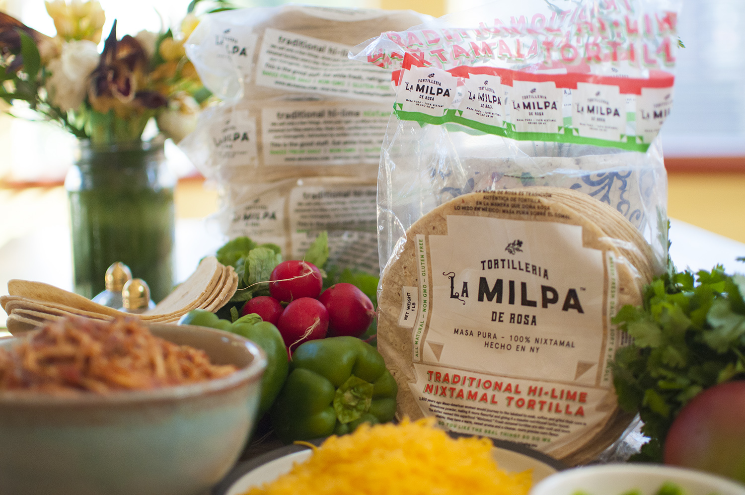 Authentic Mexican nixtamal, regular and blue masa, tortillas, and chips