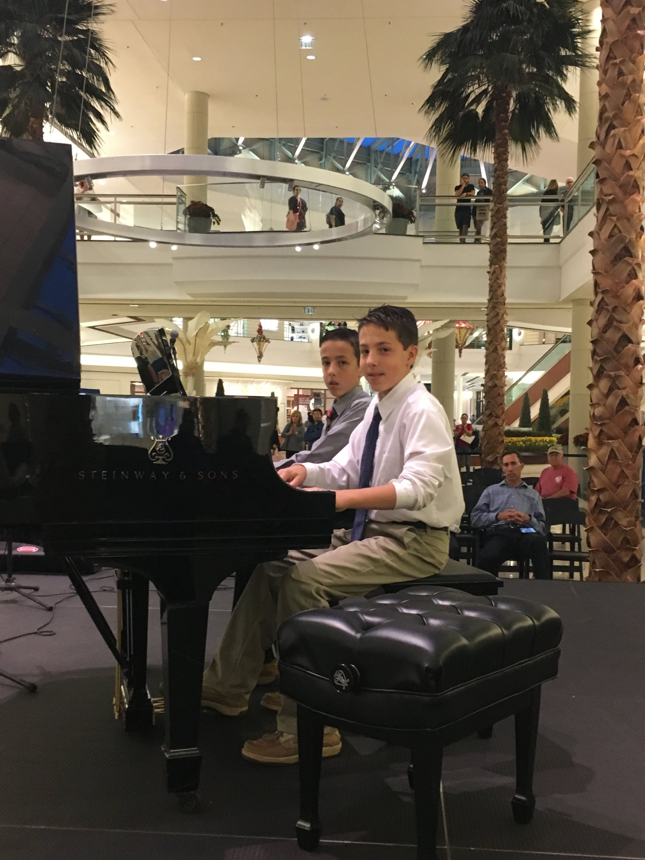  The Porter Brothers performing along with 20 other JAM students at the Gardens Mall. 