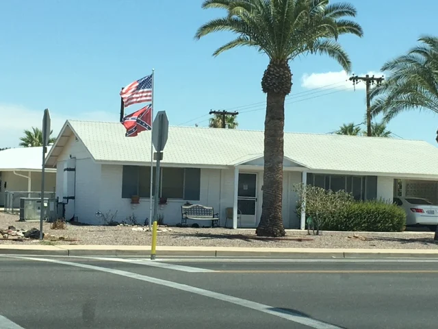 Old Bigot's House in Sun City.  An outright insult to our country's flag.  All this a-hole is missing is a Trump sign.  Let's make America great again, like in the 1860's.