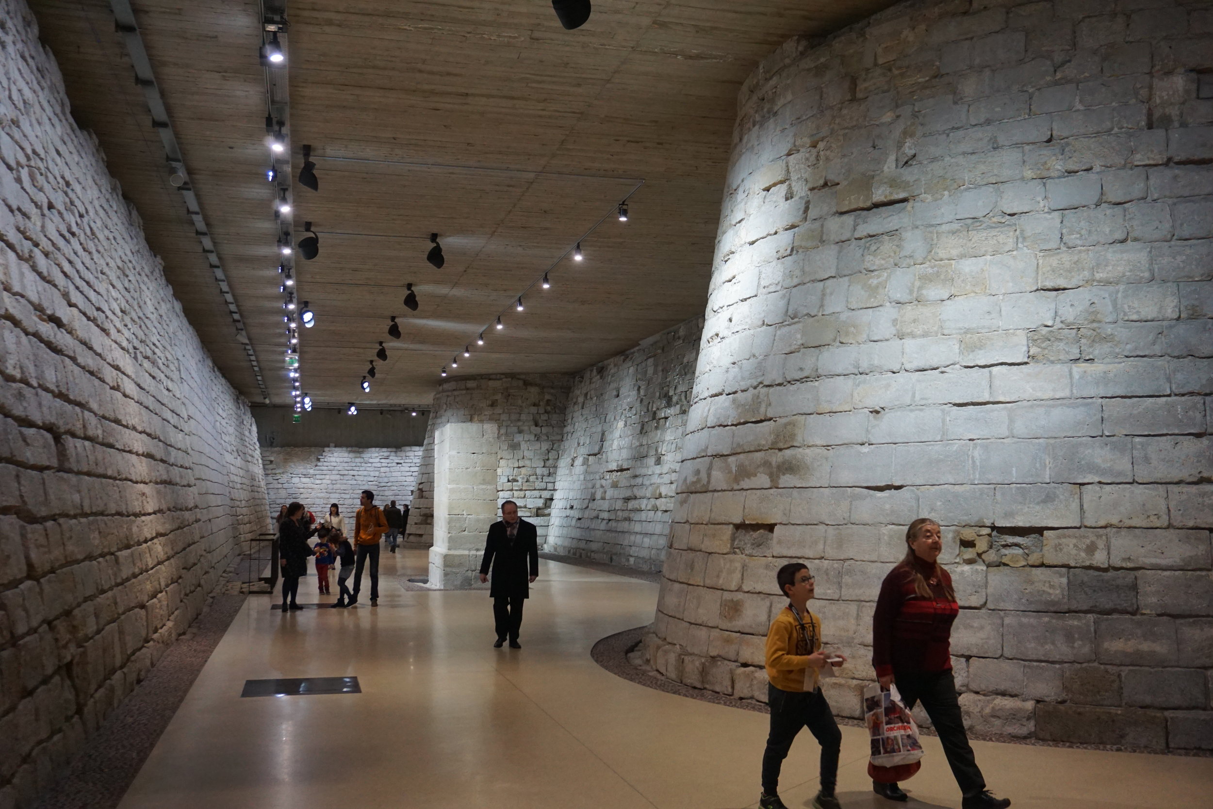  In the lower reaches of the Louvre you will find the original walls of the fortifications of the palace fortress.  The pavement was the bottom of the moat that connected to the Seine. 