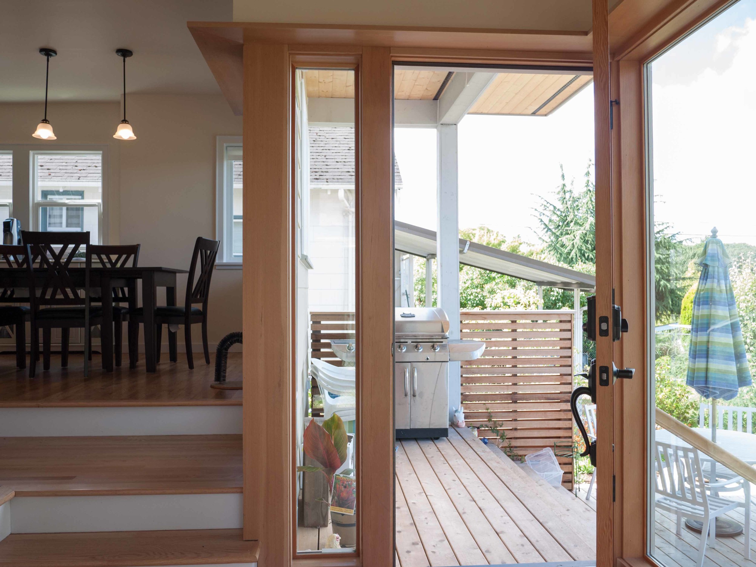 The mudroom opens to the outdoor deck. The ledge above the windows and doors provides a catwalk for our clients' cats. 