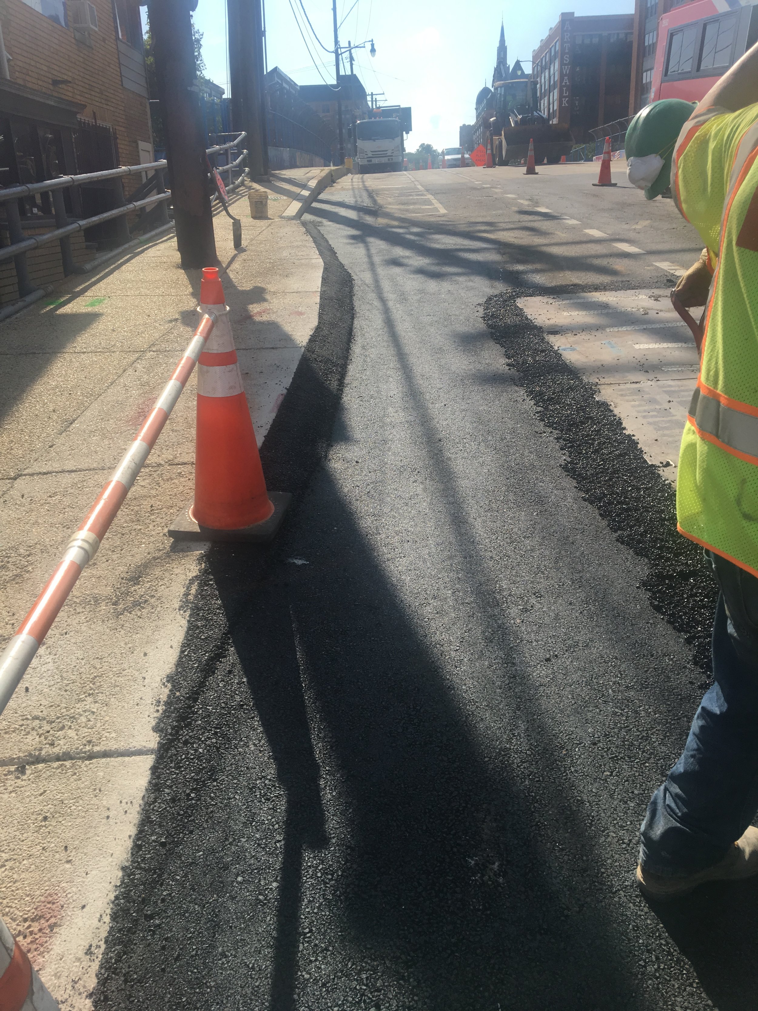 Bump out cut and temporary pavement at the intersection of Monroe and 9th