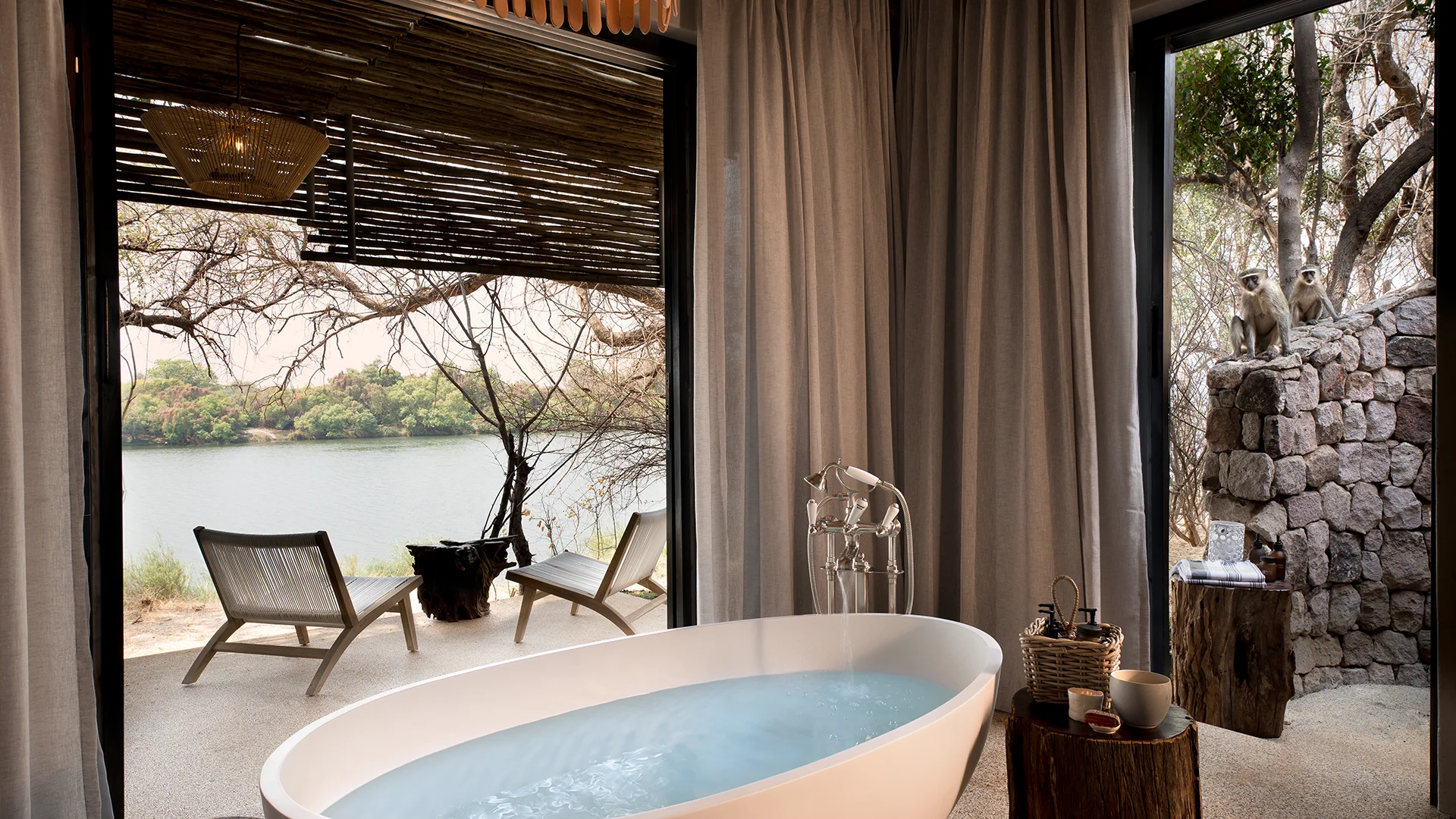 bathroom-overlooking-zambezi-river-at-andbeyond-matetsi-triver-house-on-a-luxury-zimbabwe-safari.jpg