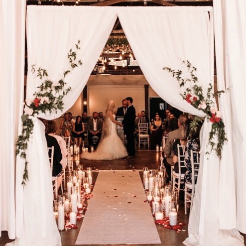 This stunning ceremony at @gatheronbroadway captured by @carleesecor 👌🏼😍 We LOVE seeing the end product of every couple&rsquo;s vision; such a fun surprise once the seats are filled and pictures are shared #goldchivari #gbwedding #greenbaybride #v