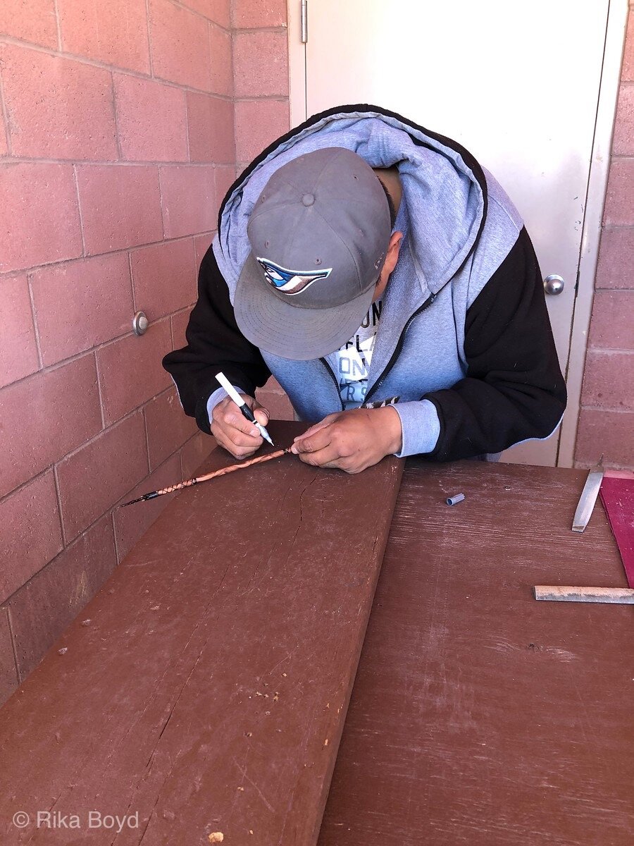 Four Corners, artist signing his arrow