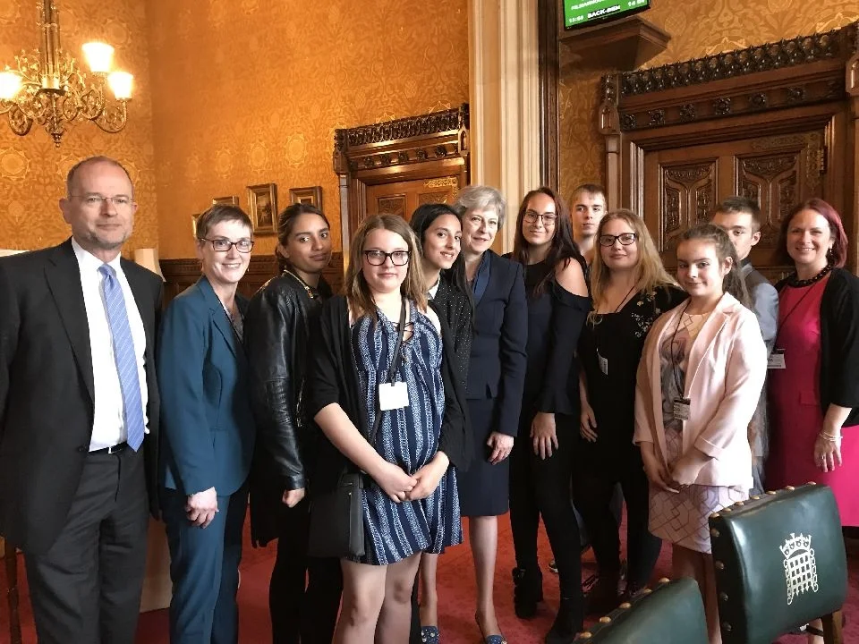 Young carers urge Theresa May to act