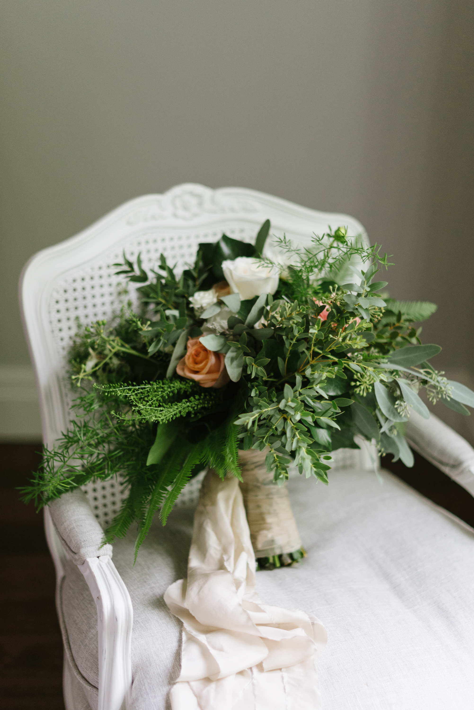 An oversized, loosely-arranged, garden-inspired bouquet by Lyric Flowers , for St. Marys bride Ashton Staffen . Photography: Erin Leydon .