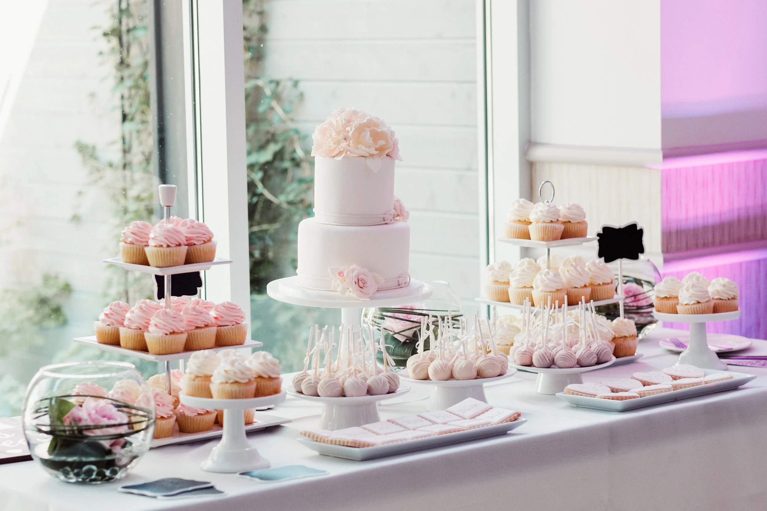Colour-coordinated wedding cake and sweets table, designed by The Cake Box . Venue: St. Marys Golf & Country Club . Photography: Bassem .