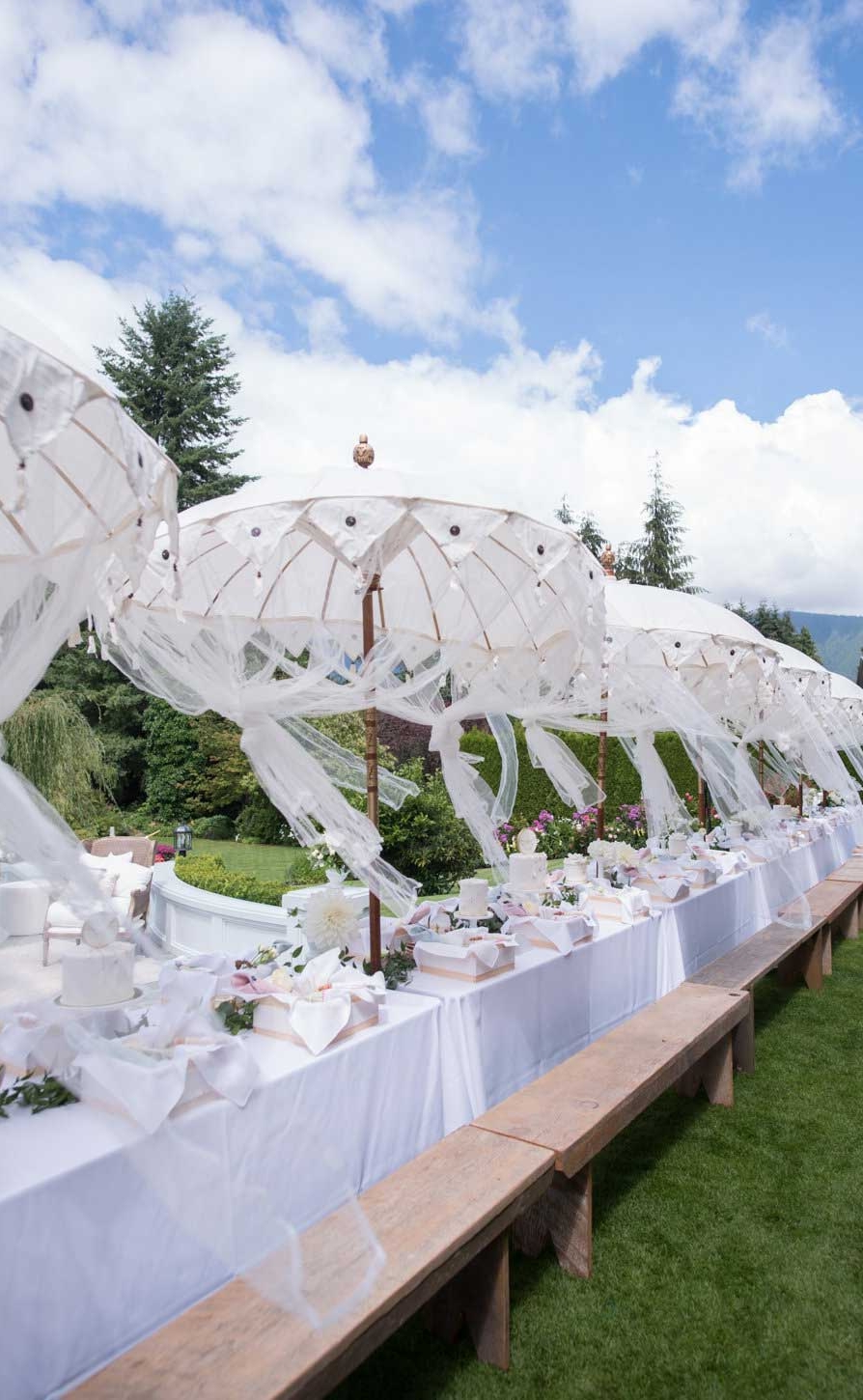 garden-party-white-umbrellas-wood-benches.jpg