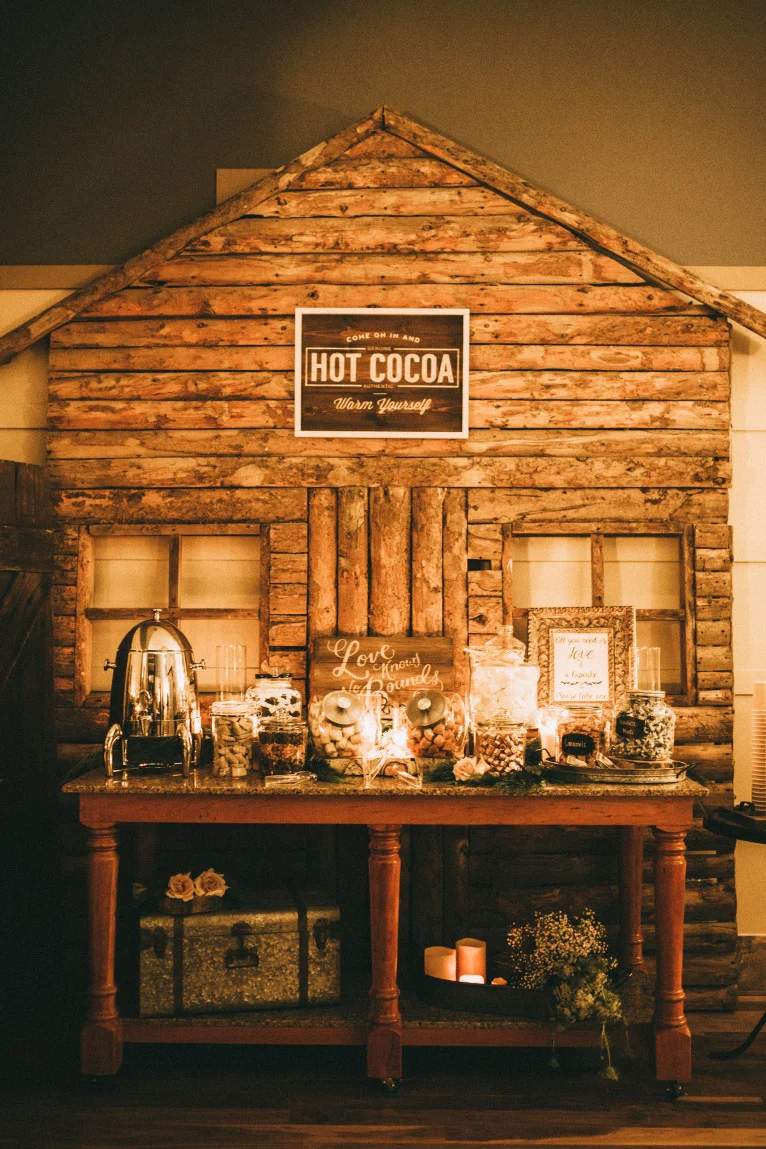Keep guests of your winter wedding warm by offering a rustic-inspired hot cocoa bar, complete with all your favourite treats and fixings. Photo Source: India Earl Photography .
