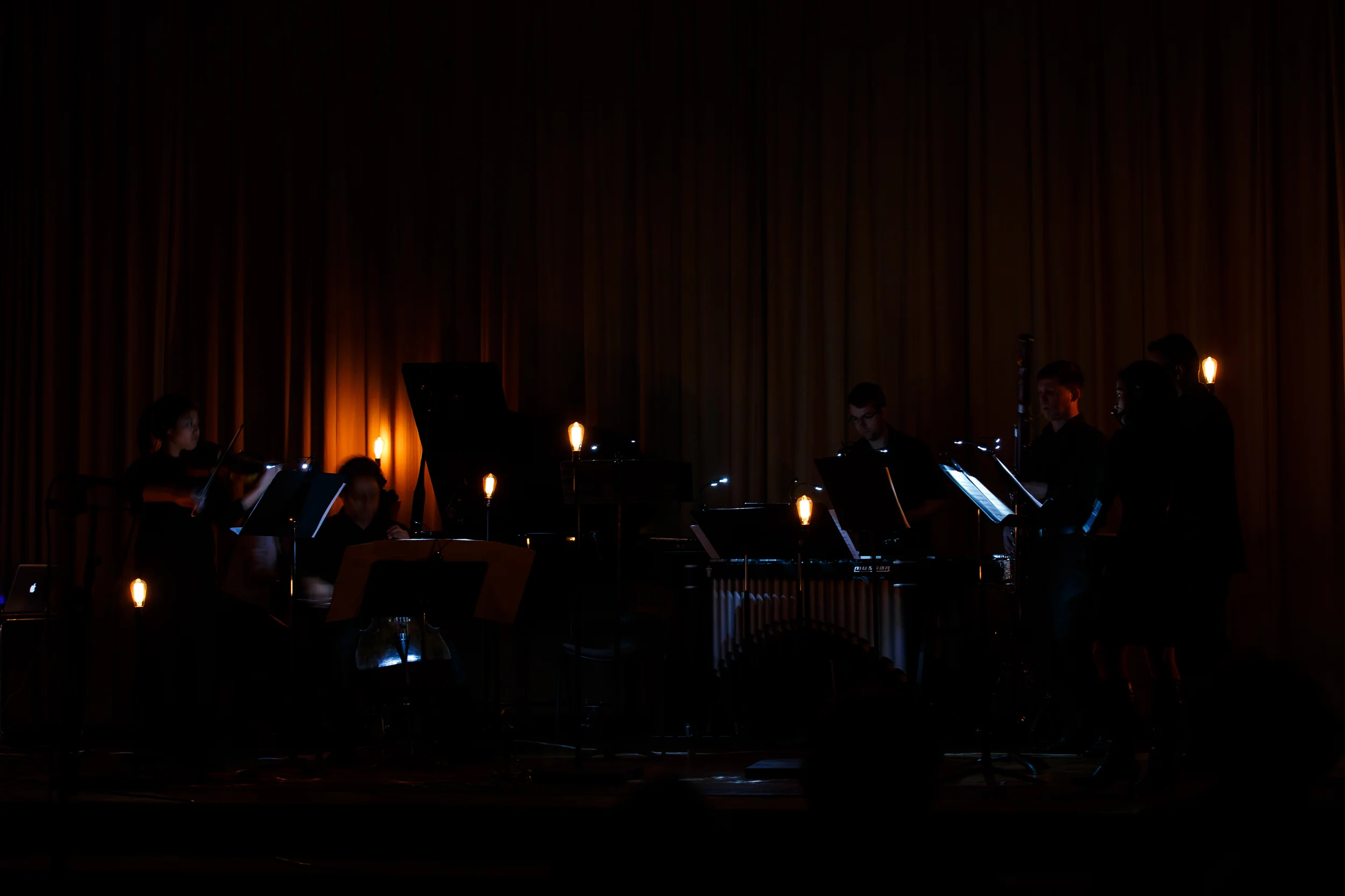 A low lit scene from Kaito's Nakahori's Zero. In this work the lights react subtly to the overall volume of the ensemble.