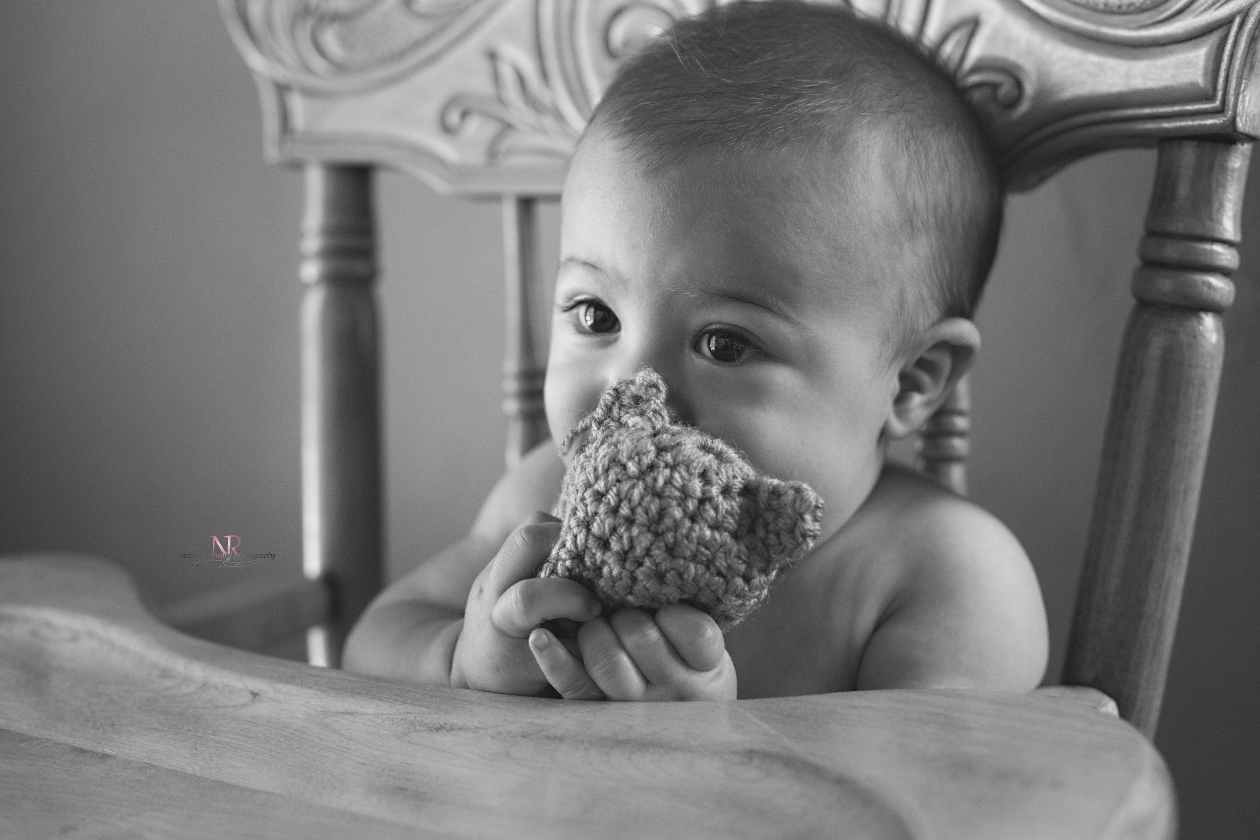 He just mastered the art of bringing everything he touches to his mouth! His eyes are so big and those lashes!