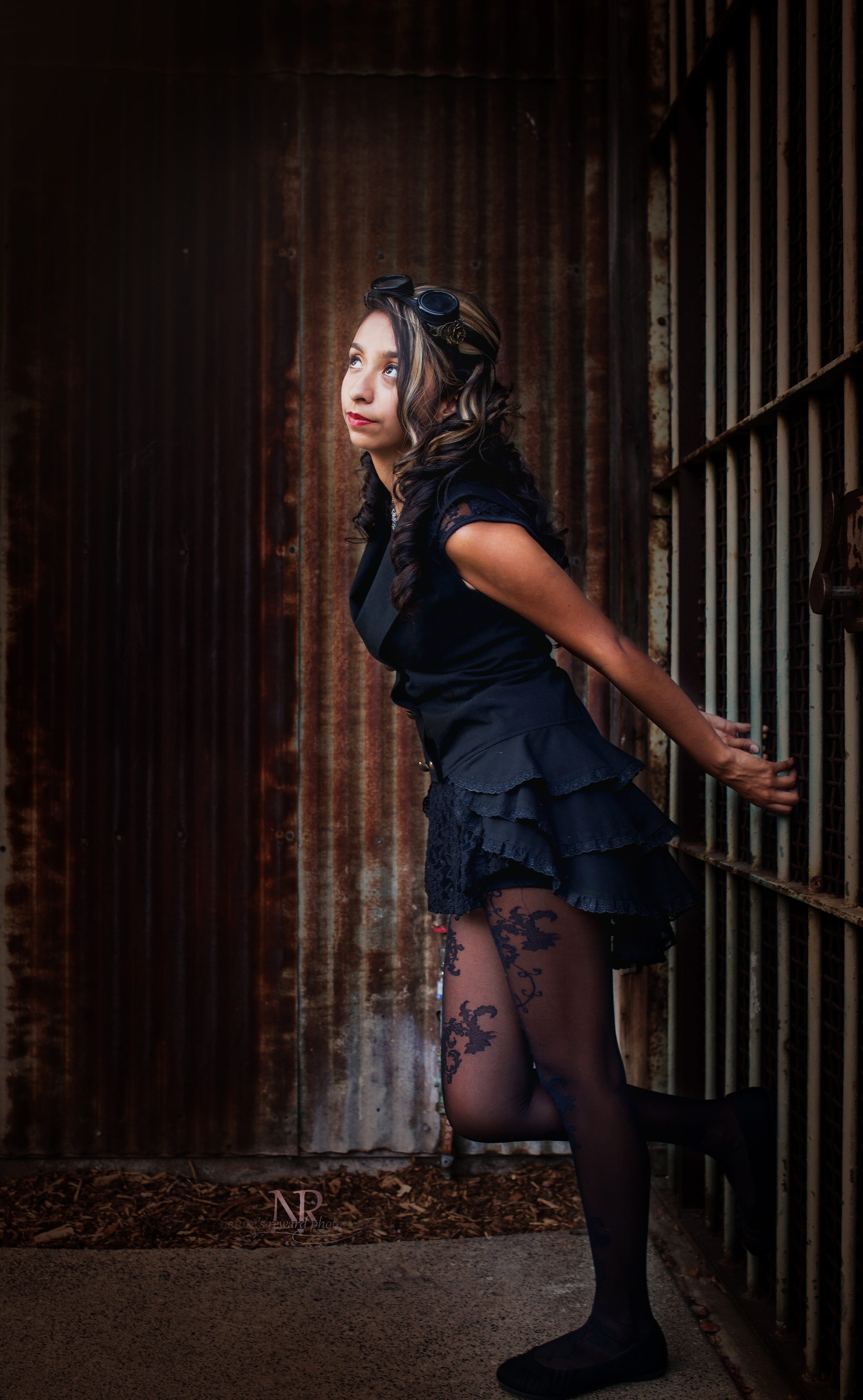 A darker edit to make her face pop among the brown tones in this wonderfully steam punk inspired image