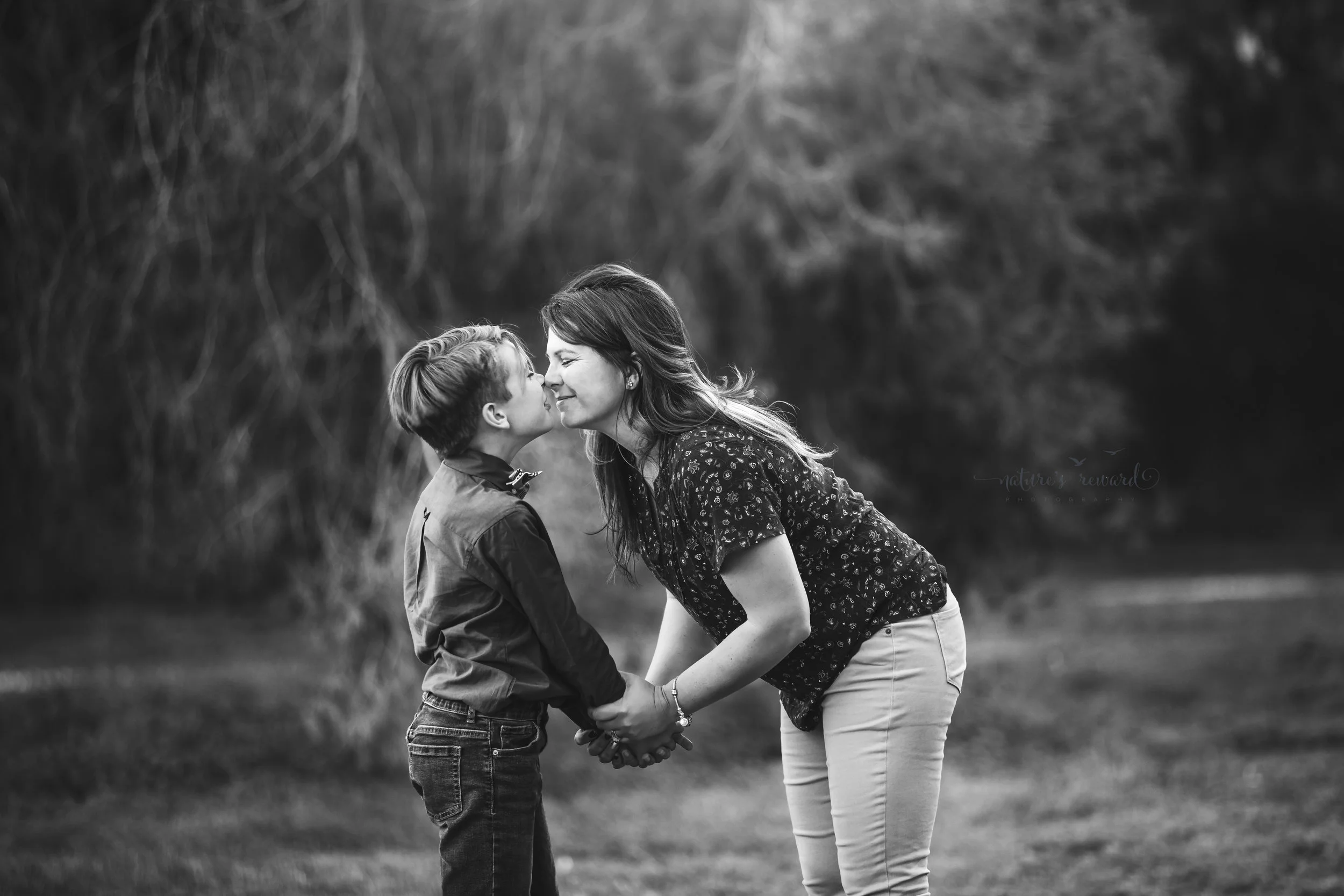 Gorgeous Black and white Imagery of a mother nose kissing her son.