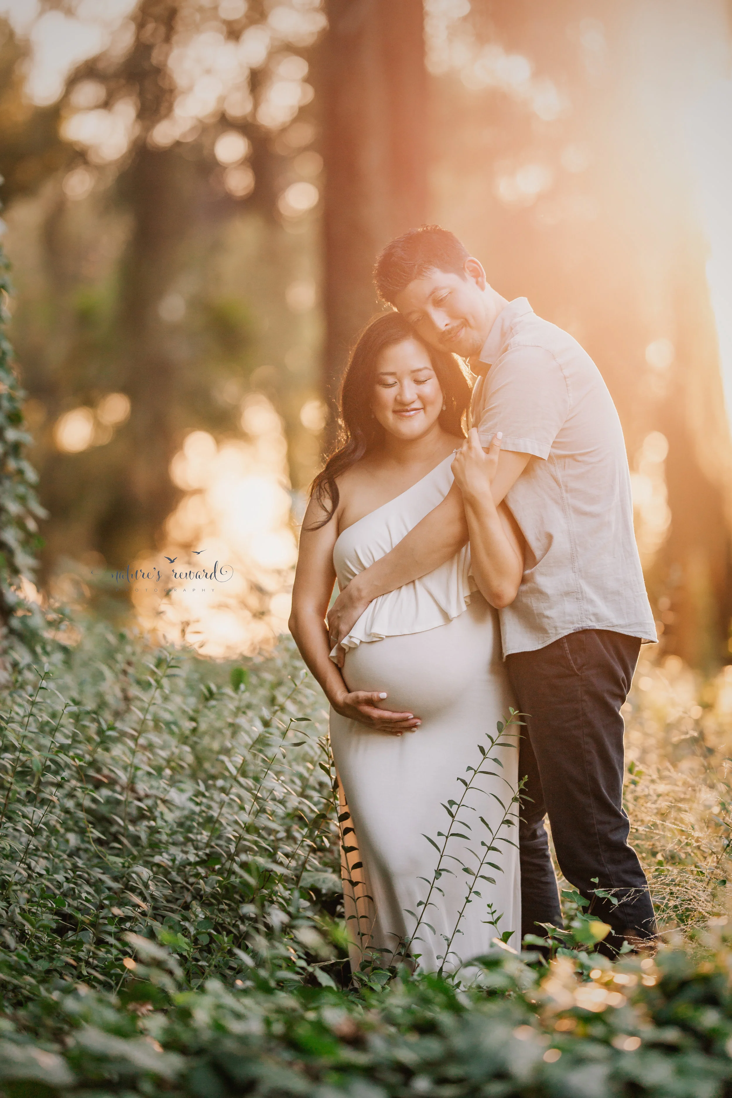 An embrace in golden light- maternity session portrait