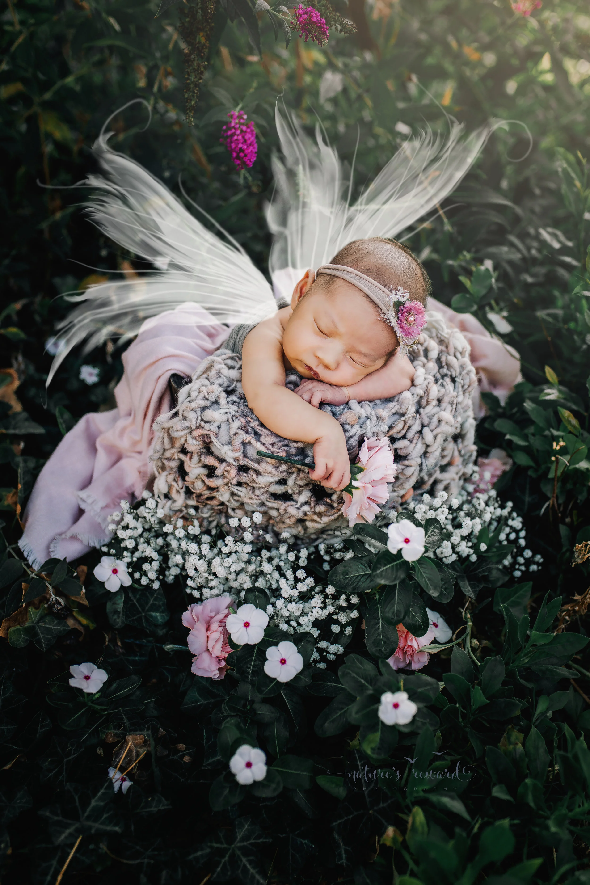 Fairies do exist! Newborn Baby girl in home-studio garden set up.