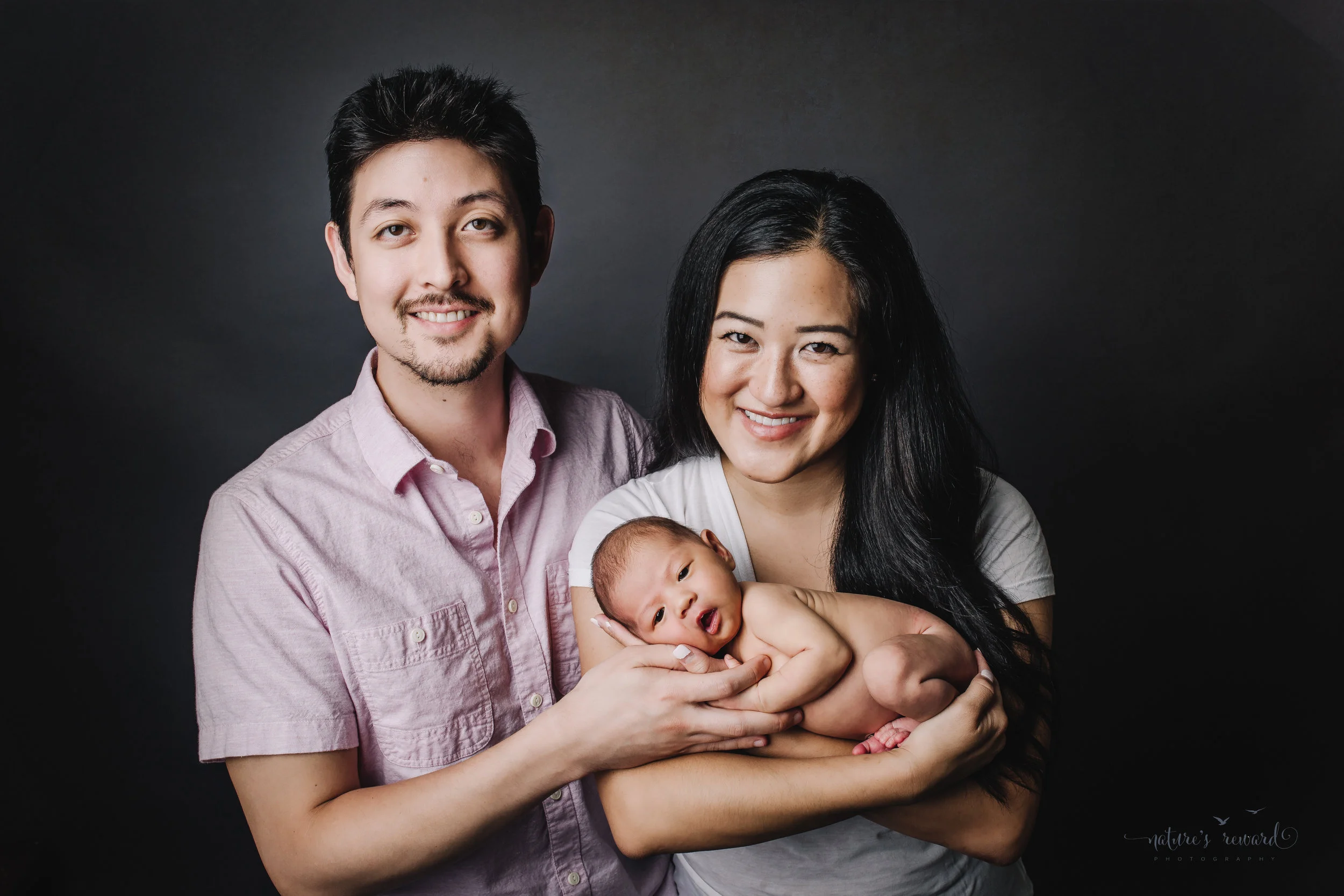 Perfect family newborn portrait by Nature’s Reward Photography