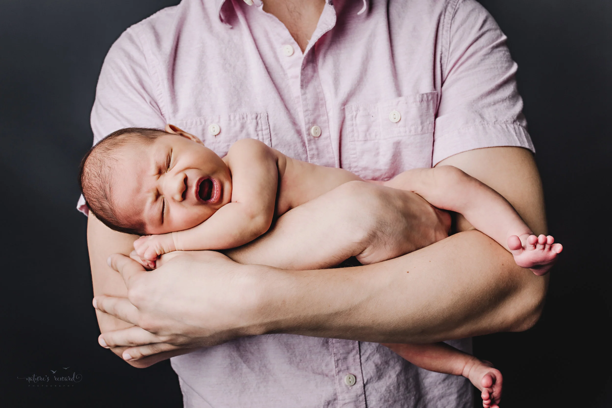 Perfect family newborn portrait by Nature’s Reward Photography