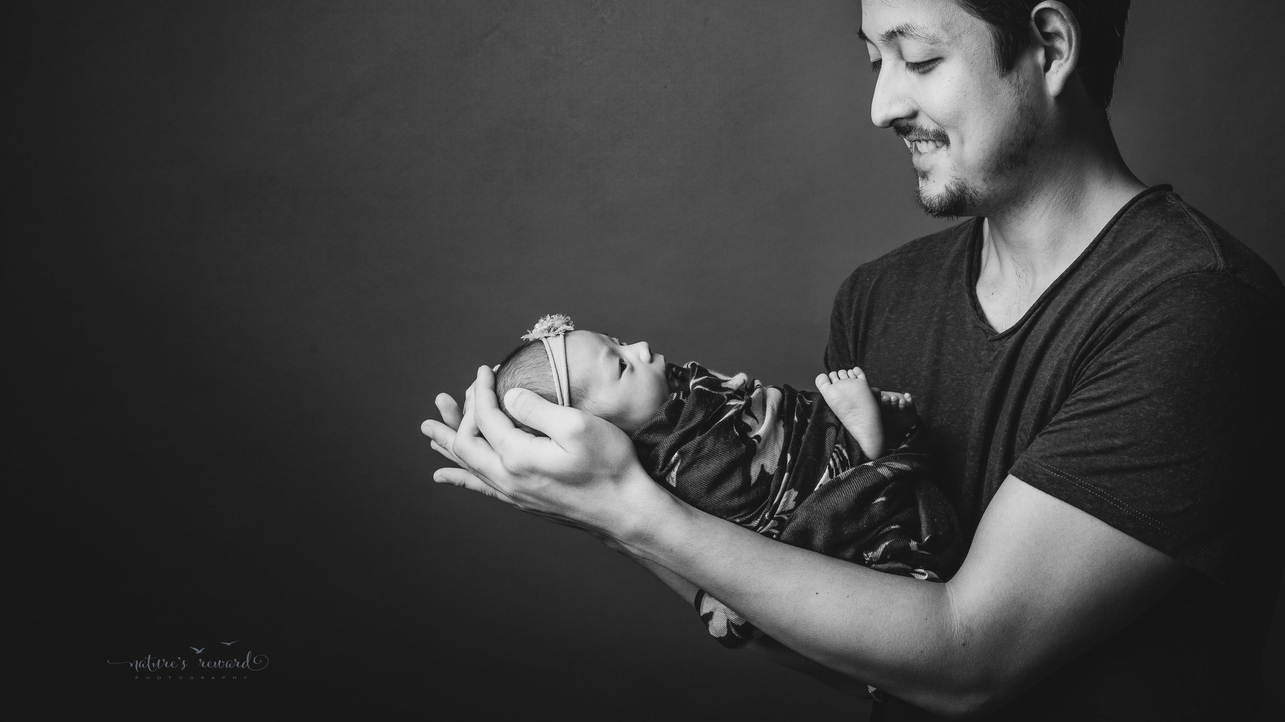 Perfect family newborn portrait by Nature’s Reward Photography