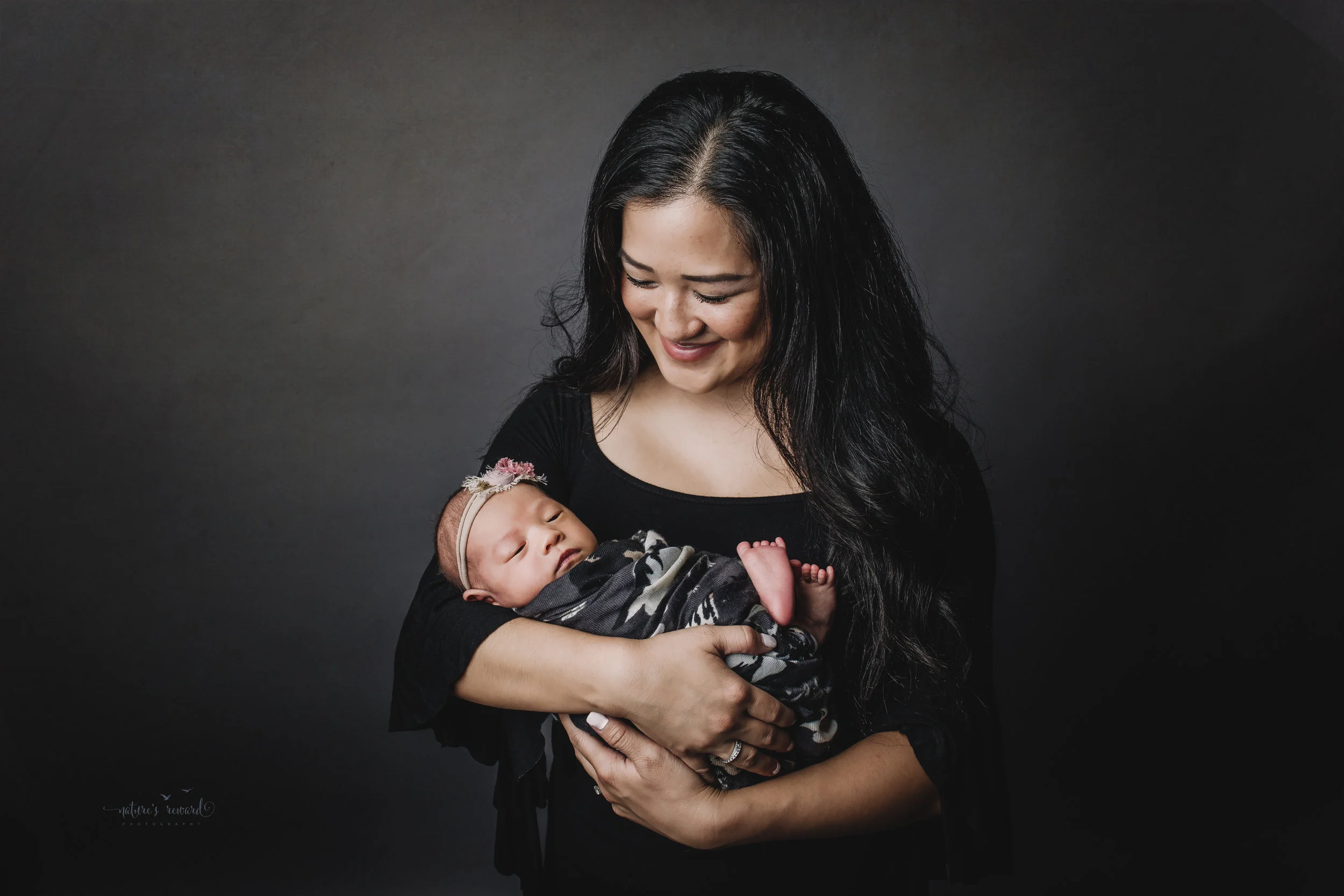Perfect family newborn portrait by Nature’s Reward Photography