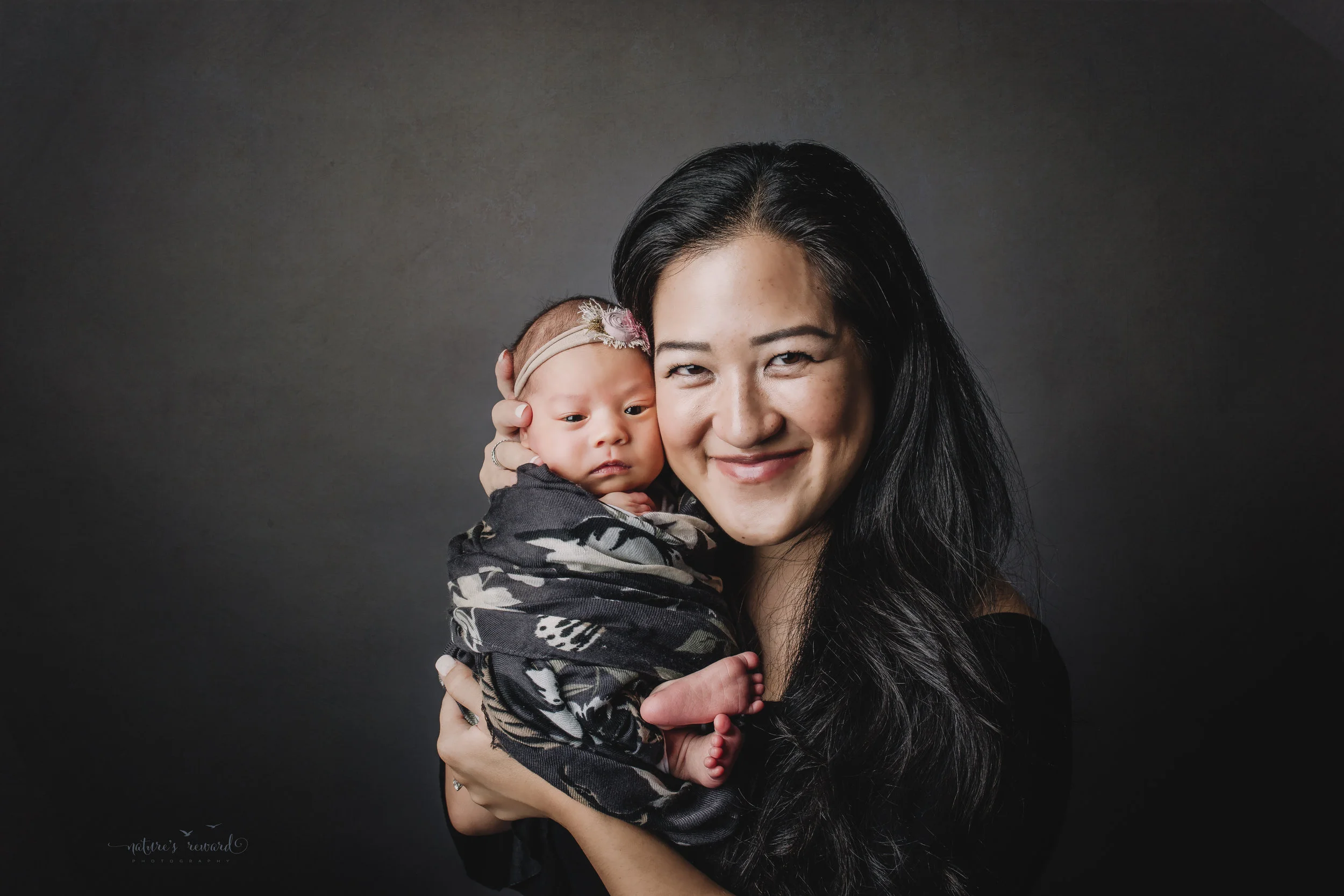 Perfect family newborn portrait by Nature’s Reward Photography