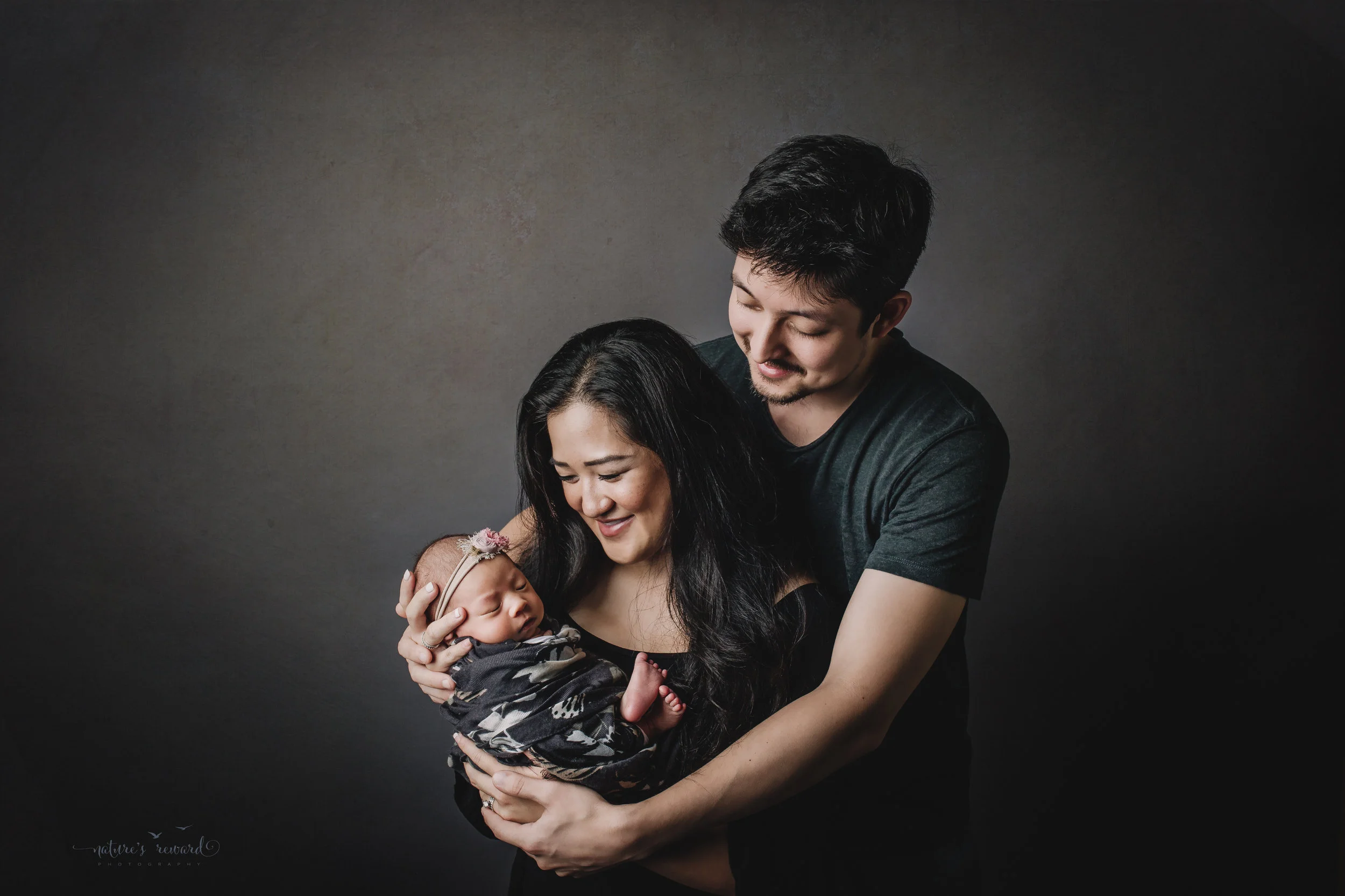 Perfect family newborn portrait by Nature’s Reward Photography