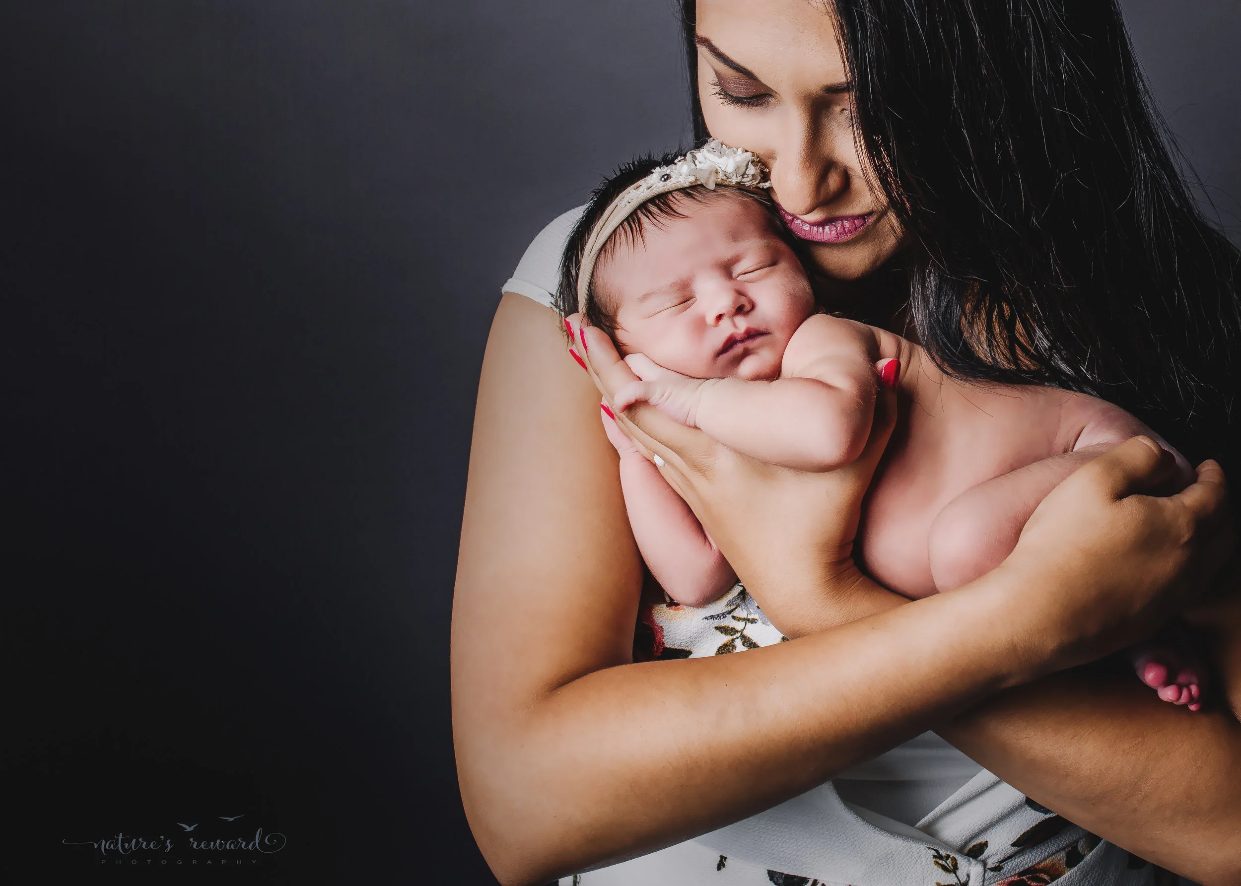 Mother and newborn baby girl portrait by Nature’s Reward Photography