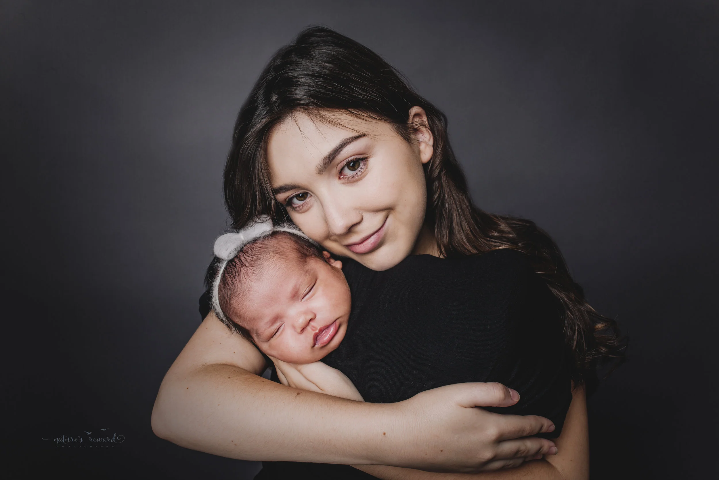 Mom and newborn baby girl portrait by Nature’s Reward Photography