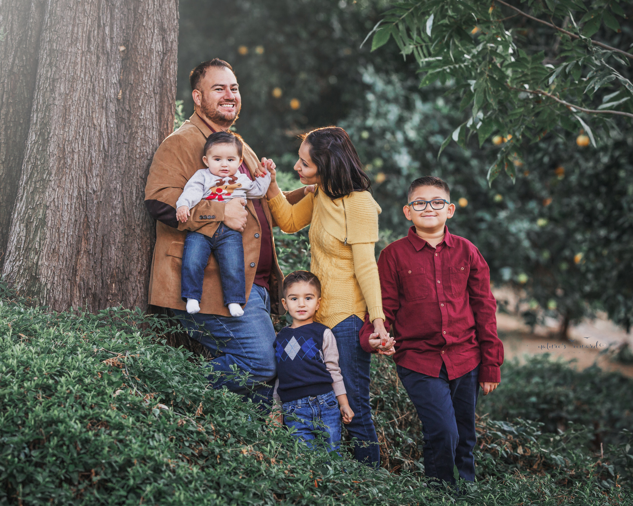 A candid of a family in a park setting by Nature’s Reward Photography