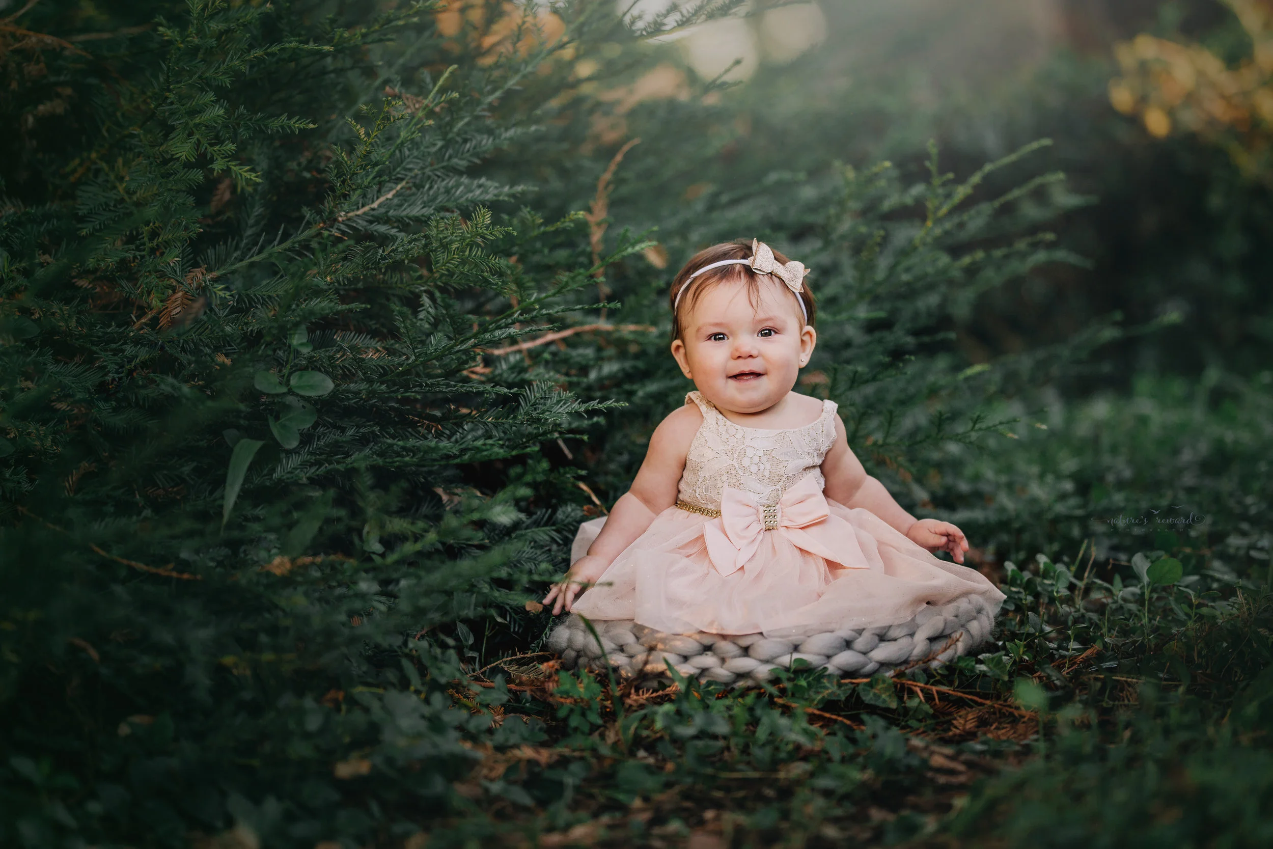 6 month old little girl during her sitter session portrait session by Nature’s Reward Photography