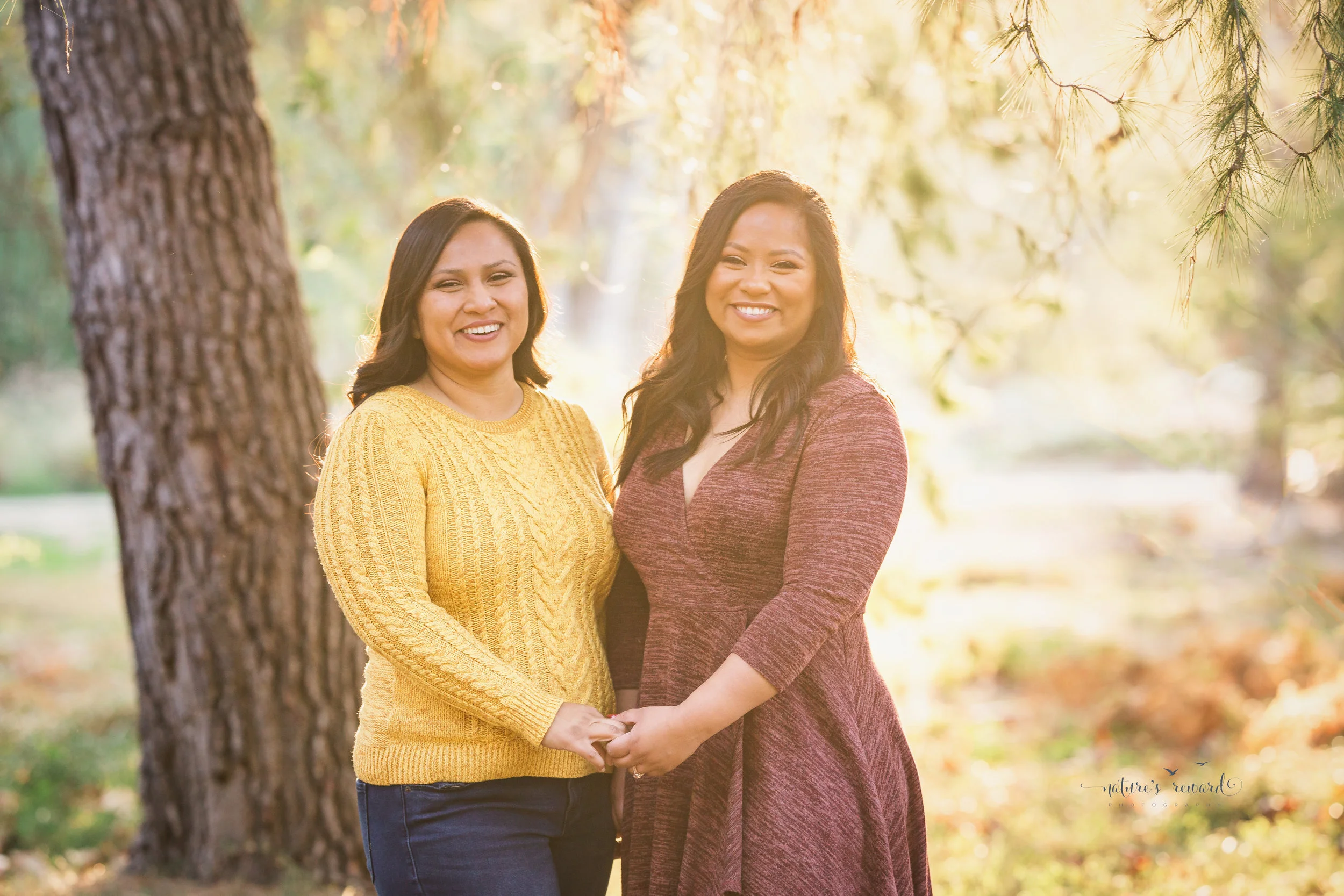 Sunset light on this portrait of two sisters by Nature’s Reward Photography