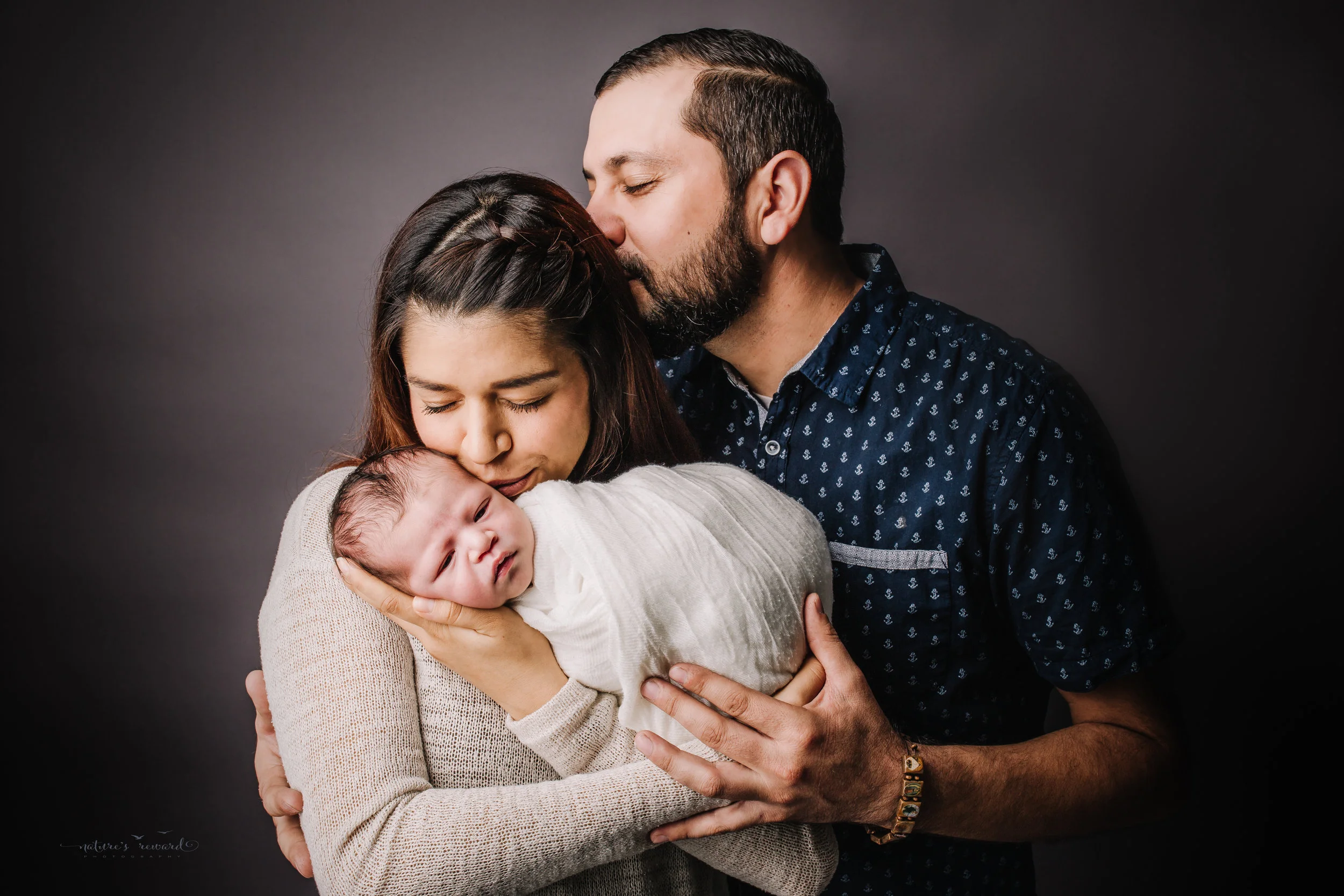 Newborn baby boy with his mom and dad by san Bernardino’s maternity, newborn and family photography, Nature’s Reward Photography