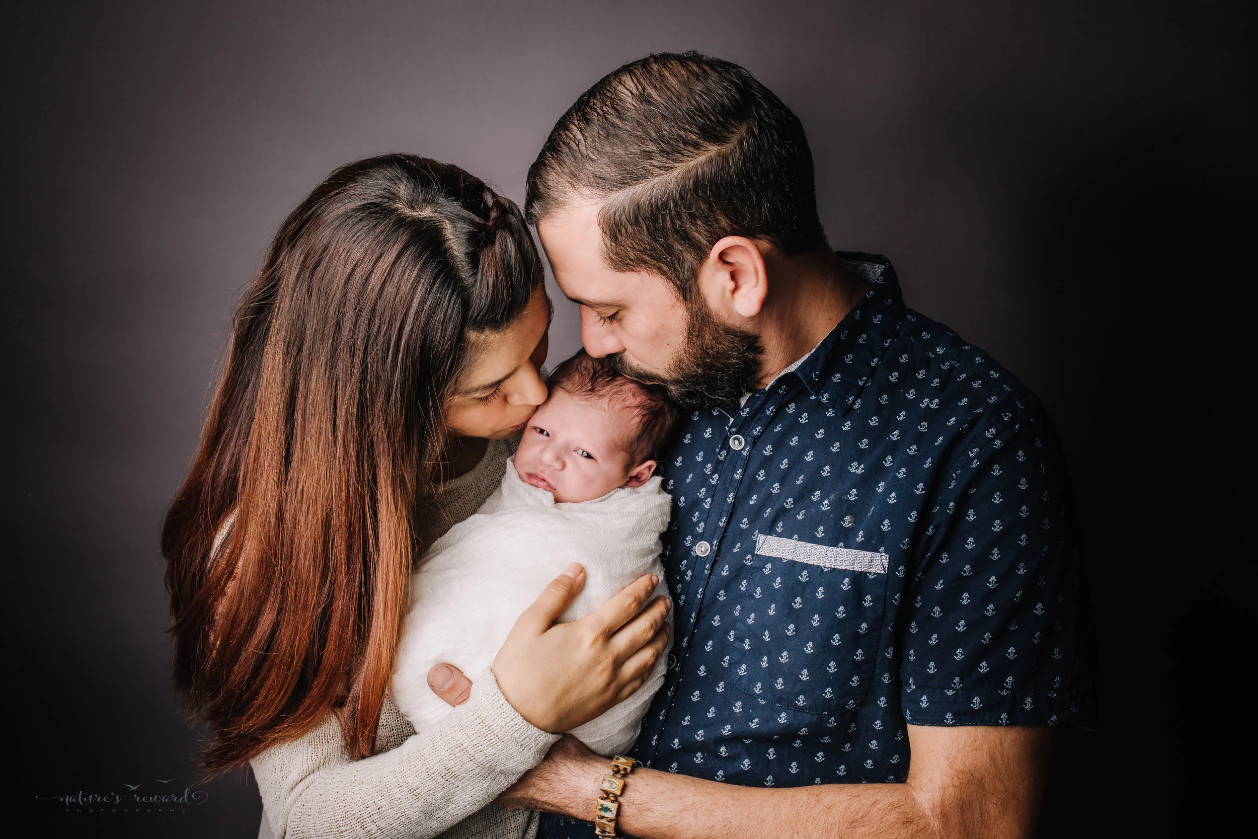 Newborn baby boy with his mom and dad by san Bernardino’s maternity, newborn and family photography, Nature’s Reward Photography